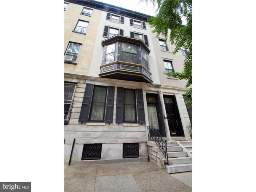 This is a grand scale 1860's home with fantastic character and charm! 5 bedrooms, 3.5 baths, formal living room plus big den plus double parlor, original grand circular staircase,  New Orleans style terrace, secure 2-car parking, high ceilings, wet bar, Florida room, patio yard and tremendously beautiful details, doors, moldings and flooring throughout! Step into this masterpiece through a glass door into the vestibule with impressive marble floor and high ceiling. Elegant formal living room with hardwood floors with oak trim, marble fireplace mantle and turn of the century mirror. Next you'll find the sitting room, powder room, great family room/den with built-in wet bar and rear Florida room with exposed brick and French door out to the landscaped slate and brick patio yard with greenery plus secured 2-car parking! Handsome original circular wood staircase leads to the 2nd floor, which begins with the dining room with its ornate fireplace mantle, large crystal chandelier and pantry door leading into the eat-in kitchen featuring stainless steel appliances including a Wolf 6 burner stove and Viking dishwasher. Off the hall is a walk-in closet, then double doors lead to the double parlor with tons of light, wood mantle, ornate archway, built-in shelving and door to New Orleans style terrace. The third floor features two bedrooms suites and an additional single bedroom. The fourth floor offers two more bedrooms and a full bath off the hall. Full basement for storage and laundry. Truly a must-see home in a highly desirable Rittenhouse Square location! Note:  Seller cannot settle before September 23.