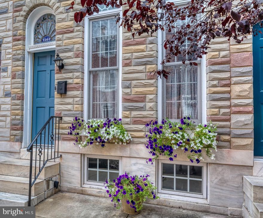 Gorgeous historic Riverside home welcomes you. Updated entirely, while preserving the quint charm of historic value, you will be wowed by gleaming original parquet hardwood floors with inlay wood, solid wood trim around custom oversized windows, high ceilings and amazing layout. The main floor offers a large living room, separate dining room, leading you into a custom-built two-row solid wood kitchen with granite and new stainless steel appliances. French door will lead you to a main floor bedroom/den area, opening up to a beautiful brick paved outdoor patio (also easily made into a parking pad). Second floor offers two large bedrooms and a spacious bathroom drenched with natural light through the skylight.  Back bedroom leads you to a brand new two-tier rooftop deck with breathtaking views of the city and the water. Among many upgrades, BRAND NEW ROOF and 2-Tier ROOFTOP deck, updated cooling system, new appliances, refinished hardwoods, and more. Perfect location near the Riverside Park, blocks away from Inner Harbor waterfront, near all local restaurants, with an easy access to downtown and all major highways.