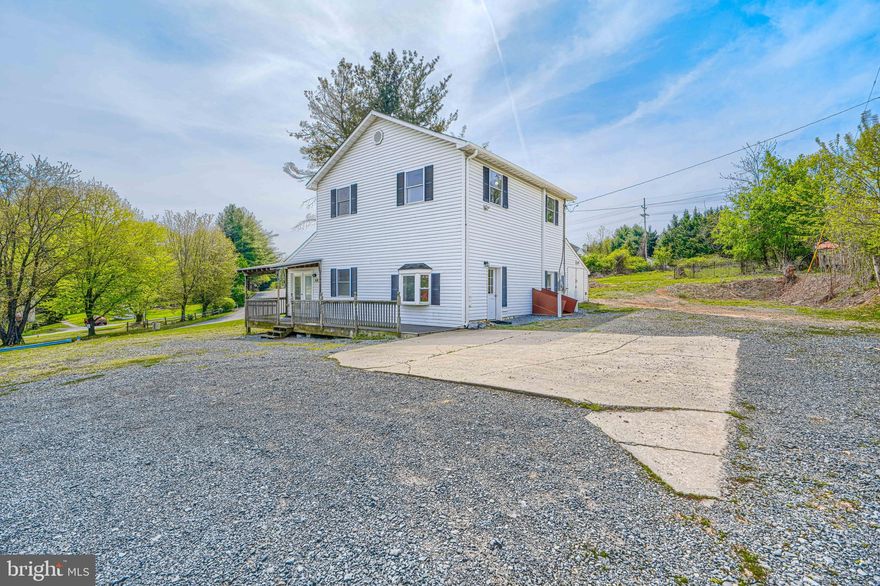 Located along Old National Pike just minutes from I-70, this property offers over half an acre outside of city limits (no city taxes) with plenty of parking. The lot extends to the rear with a gentle incline, providing additional outdoor space.

The home has seen updates over time and is currently set up in three separate sections, including an upper-level 1 bedroom, 1 bath area with a full kitchen and new stove, along with two main-level areas that allow for a variety of uses.

New hot water heater installed May 2024.