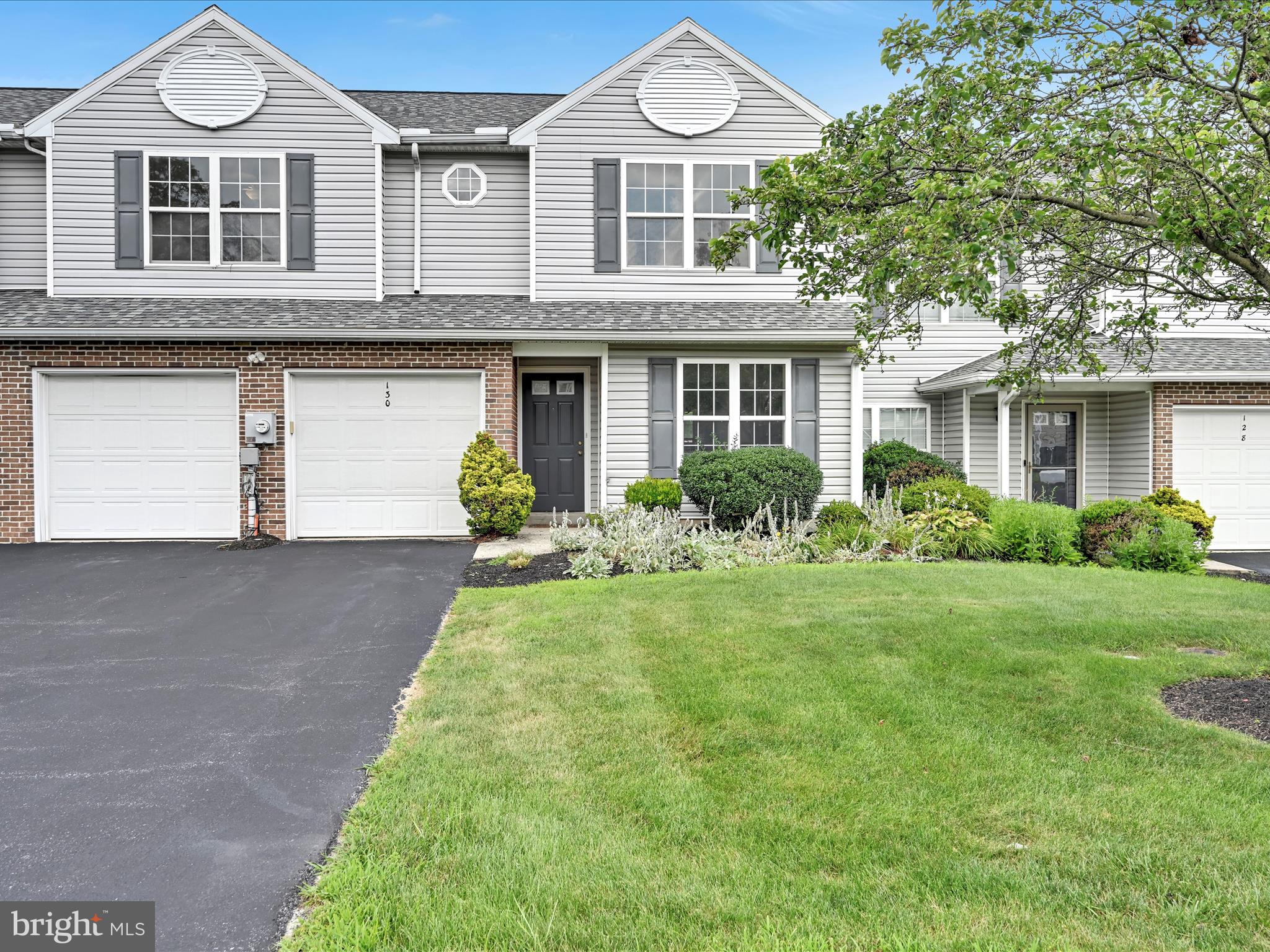 The move is on to this charming and versatile town home with a first-floor primary suite and year-round sunroom! Explore the bright and open layout with vaulted ceilings plus fresh paint throughout. The large kitchen even has new countertops. The sunroom overlooks a private fenced yard. Never worry about exterior maintenance. It’s the perfect blend of convenience, comfort, style, and function. Click the virtual tour for an immersive walkthrough.