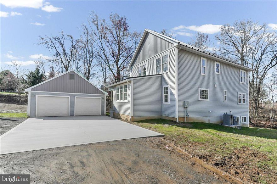 Experience a custom-build retreat designed with unmatched care and character. Far from  your typical new construction, this home welcomes you with extra wide staircases, elegant bullnose trip and oversized windows that bathe every room in natural light. The heart of the home is a warm, expansive kitchen featuring top-tier appliances, Wilsonart solid-surface counters, and a massive island perfect for gathering. Retreat to the sounds of a rainy night under the lifetime metal roof, or enjoy the peace of your 3/4-acre lot overlooking a serene babbling brook. Built for efficiency with dual heating systems and propane backup, this unique property is move-in ready and waiting for you.