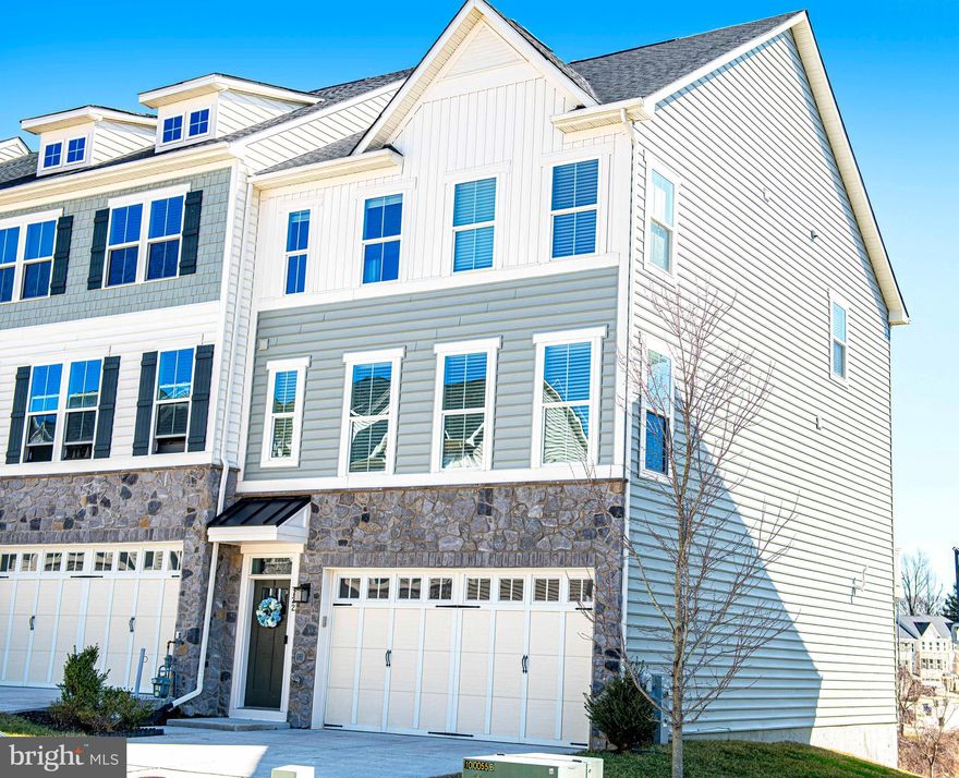 STUNNING Like-New End-of-Group Townhome in Desirable Magness Mill!

Welcome to this beautifully designed and upgraded end-of-group townhome in the highly sought-after Magness Mill community, offering exceptional space, premium finishes, and a private wooded backdrop.
This impressive home features 3 bedrooms, 3.5 bathrooms, along with a 2-car garage and bump out extensions on every level, creating expanded living space throughout the home. The main level showcases hardwood flooring throughout and an open, light-filled layout perfect for everyday living and entertaining. The gourmet kitchen is designed to impress with premier upgrades like a custom backsplash, abundant cabinetry, generous island prep space, and an extra built-in nook that could be used as anything from a  work space to a wine bar.  Step outside to enjoy the largest deck in the neighborhood - an expansive 22' x 12.5'  low maintenance deck - perfect for entertaining, grilling, or relaxing while overlooking peaceful wooded views. Upstairs, the spacious primary suite offers a comfortable retreat with a walk-in closet and a sophisticated private bath featuring a custom tiled Roman shower with seat and a huge vanity with two sinks. Two additional bedrooms, another full bathroom, and the laundry room finish off the upper level. The finished, walk-out lower level includes an additional full bathroom and versatile living space with grand ceilings. Right inside the garage find the convenient “arrival center” with built-in cabinets and a bench and coat closet. Not only is the community of Magness Mill in the perfect location, the HOA covers lawn maintenance, snow removal, and trash!