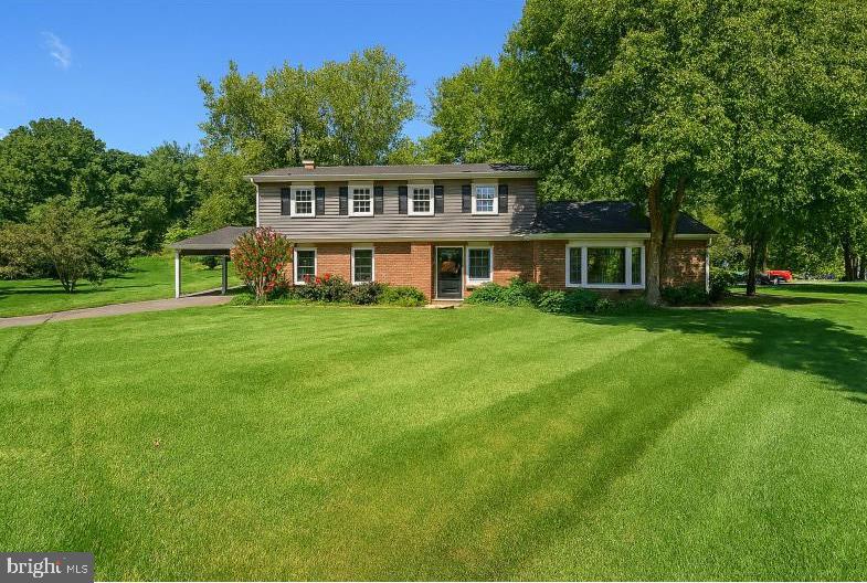 Welcome to this light-filled, impeccably maintained Colonial-style home nestled on a picturesque ⅓-acre corner lot in the heart of North Bethesda’s sought-after Tilden Woods neighborhood. With nearly 3,000 square feet of interior living space, this detached single-family residence offers timeless charm, modern comfort, and a lifestyle surrounded by nature and convenience.
Step inside to pristine hardwood floors and a classic Colonial layout that balances tradition with contemporary flair. The main level features a formal living room with a bay window that floods the space with natural light, a separate dining room perfect for entertaining, and a sunny eat-in kitchen. A cozy family room with a fireplace, a private den, and a convenient half-bath complete the spacious first floor, offering ample room for both relaxation and productivity. For added flexibility, the home includes a dedicated office with its own private exterior entrance—ideal for remote work, client meetings, or a quiet creative retreat.
Outdoor living is elevated with a private deck ideal for al fresco dining, and a fire pit area perfect for gathering under the stars. The expansive yard is a gardener’s dream, featuring a year-round bloom garden filled with curated annuals and perennials, all supported by an upgraded irrigation system for easy maintenance and vibrant seasonal color.
Nature lovers will appreciate the proximity to Tilden Woods Local Park, just a short stroll away. This serene 8.8-acre park offers winding walking trails and shaded paths for peaceful morning jogs or evening strolls. For more adventurous outings, nearby Cabin John Trail Loop and Rock Creek Regional Park provide miles of scenic hiking and biking trails, inviting you to explore the beauty of Montgomery County’s natural landscape.
Upstairs, the home offers three spacious bedrooms and a renovated full bathroom, along with a sun-drenched primary suite featuring its own ensuite bath. Thoughtful storage solutions and maximized closet space ensure comfort and functionality throughout.
The fully renovated lower level includes a full bathroom and flexible space ideal for a guest suite, home theater, gym, or office. A generous 200+ square foot storage room adds to the home’s impressive capacity, making organization effortless.
Exterior features include a covered carport, parking for three vehicles, and a storage shed for tools and seasonal gear. With easy access to I-270 and North Bethesda Metro, commuting is a breeze. The home is also just minutes from North Bethesda Town Center, Whole Foods, Target, and a vibrant mix of dining and shopping options.
Located in the highly regarded Walter Johnson School District, this home offers both lifestyle and legacy. Families will appreciate access to top-rated public schools known for their academic excellence, vibrant extracurricular programs, and strong community engagement. Tilden Woods isn’t just a neighborhood—it’s a way of life. This property invites you to live beautifully, entertain effortlessly, and explore nature daily—all from the comfort of your own corner-lot sanctuary.