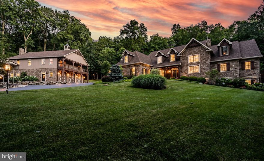 Welcome to your luxury mountain retreat right here in the heart of Chester County, offering 27.5 acres of privacy and stunning craftsmanship and mechanicals throughout. The main house has a wide-open floor plan with a first floor primary suite.  Lots of windows, a two story living area, and the second floor loft let light flow through this home. The main living area features a two story living room that opens to the kitchen and dining rooms and is anchored by a beautiful stone fireplace. The kitchen has all the bells and whistles, including a Sub-Zero refrigerator/freezer, 6 burner Wolfe cooktop and range with griddle, Wolfe double wall ovens, a Miele dishwasher, a wine cooler and a Sub-Zero ice maker.  An oversized island is the perfect gathering place for all your entertaining needs. The first floor primary suite has every detail covered. There’s a gas fireplace, double walk-in closets (by Closets By Design), and a patio off the bedroom. The primary bath has radiant hot water heated floors, a soaking tub and separate walk-in shower, as well extensive granite, woodwork and cabinetry. A generous first floor laundry/storage room, full hall bath and access to the 2 car garage round out the first floor. The second floor is accessed by front or rear staircases and has a big open loft area overlooking the living area. There’s a craft room, 2 bedrooms and a full bath as well as deck access from the loft. There’s enough space to easily add another bedroom or two in the loft area.
A walkout daylight basement affords plenty of options for storage, a home gym, or another bedroom and bathroom (plumbing is already roughed in) as well as a glimpse into the superior construction and mechanicals of this home. Please ask for the features sheet for more information.
The detached oversized garage has an amazing finished entertainment area with a vaulted ceiling and a full bath and bedroom plus a full kitchen with a wine cooler - use it as another residence, or for the ultimate place to watch the big game. A wrap-around deck is the icing on the cake. You’ve got to see this in person to grasp how awesome this area is.
The 3+ car garage below has a workshop area, a game processing or storage room, and an outdoor shower.
Extensive landscaping, decks, hot tub, a patio, a fire pit area and a retractable awning highlight this home.
This home is truly stunning and an outdoor person's dream. There are quad trails, a 'carport' for your boat or RV, a deluxe enclosed hunting blind or tree house and too many other features to list. 
All this is at the end of a cul-de-sac neighborhood just minutes away from major routes, shopping, and restaurants, yet you’ll feel miles away from the outside world. Want even more land? There’s an opportunity to purchase a contiguous 9.8 acre lot if desired - ask for details.