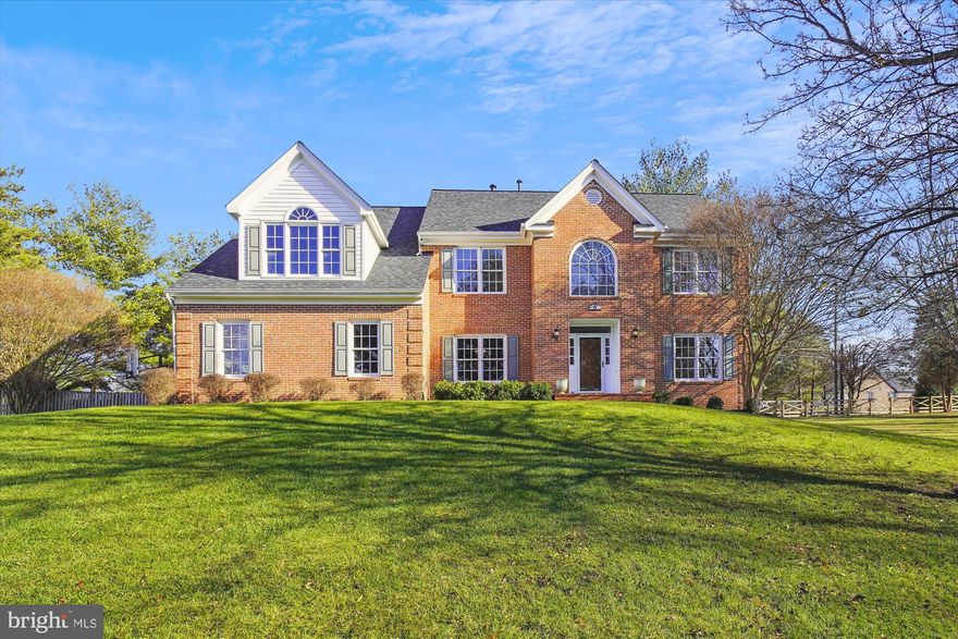 Fall in love with this impressive 4-bedroom, 4.5-bathroom colonial atop a beautiful .6-acre lot. Boasting curb appeal galore and three finished levels of nearly 5,000 square feet of living space, this meticulously maintained home offers an open layout and abundant natural light. Main level highlights include a two-story foyer, elegant dining and living rooms, a private study with French doors and peaceful backyard views, a beautiful custom island kitchen opening to a spacious family room complete with a fireplace and wet bar, plus a separate laundry mudroom. Upstairs offers a large owner’s suite complete with a large walk-in closet with beautiful custom built-ins and a luxurious primary bath, plus three additional generously sized bedrooms (each with custom closet system) and two additional full bathrooms. The lower level features a large recreation room with high ceilings, a bonus room perfect for an office/craft room/exercise room, etc., a full bathroom, and ample storage. Exterior features include a large deck overlooking a level fenced rear yard, lush rolling green space in the front, mature shrubbery and trees, and an oversized two-car garage. This move-in-ready gem is a must-see! One Year Home AHS Warranty provided by sellers!