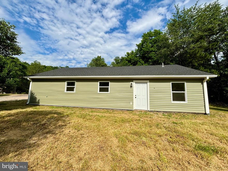 Wow! Newly renovated, private rancher situated on approximately 4 arces!  Offering a nice yard while also tucked away surrounded by trees and wildlife with a wet weather stream.  this 3 bedroom 1 bathroom home offers tons of space and a potential 4th bedroom or room for that master suite you've been wanting.  The open concept living space offers a huge living room leading to the new kitchen which features new white cabinets, quartz countertops and stainless steel appliance package.  Luxury vinyl plank throughout the home with new light fixtures everywhere.  Brand new upgraded bathroom with tile bath surround.  Other new features are architectural shingles, vinyl siding, vinyl windows, and the heat pump.  Check it out today and make it your home!