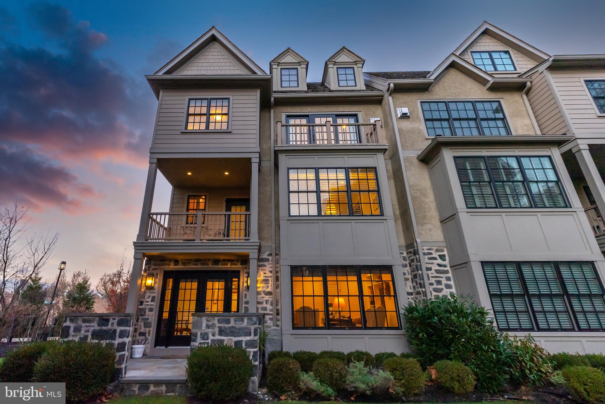Enjoy sunset views and luxurious, maintenance-free living in this gorgeous townhome in the new construction community of Overlea. This impeccably-maintained home was extensively upgraded by the current owners with custom hardwood floors, 4-floor elevator, upgraded lighting, custom window treatments, whole house sound system by Magnolia, and much more. Crown molding, custom wainscoting, and LED lighting can be found throughout. Enter into the front hall through the welcoming foyer to the first floor, which offers access to the 2-car garage and a lovely study or den with powder room, and French doors that open to a slate patio that will quickly become a favorite place for warm weather grilling and relaxing. The second floor has a sunlit open floor plan with kitchen, breakfast area, dining room, living room, and powder room. The gourmet kitchen overlooks the breakfast and dining areas and features a large, 2-level marble island with bar sink and beverage fridge, Wolf and Sub-Zero appliances, and specialty Blanko sink with high-end faucets. Step out on to the balcony or relax by the backlit gas fireplace with custom built-ins in the living room. The third floor offers a customized and functional layout, with a guest room with ensuite bath, and the main bedroom suite with sliding doors to a balcony, a large walk-in closet, and spa-like bath with walk-in marble shower and dual vanities. The fourth floor offers a third bedroom, currently used as a family room, with extensive custom built-in cabinetry, shelving and window seats, full bath and extensive storage closets, including a walk-in cedar closet. This gorgeous home is in a fantastic location across from Morris Arboretum, in close proximity to Cisco Park, the trails and recreation of the Wissahickon, the Chestnut Hill East train station, and the shops and dining of Flourtown and Chestnut Hill.