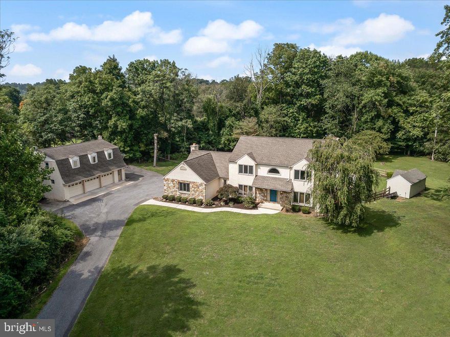 Classic Colonial with a great floor plan built by Bonaventure, one of Delaware County's premier builders.  Five bedroom and three baths with a two bay  garage in the main home; A two bedroom, one bath in law suite over the detached, three bay garage.  Spectacular, private setting with in ground pool at top of the hill with long views.  This expansive property has been well maintained by current owners and is ready for your personalized touches.  Appreciate the security of updated mechanical systems.  Kitchen features cherry cabinetry Viking & Kitchenaid appliances.  Living room and great room each offer a distinctive hearth. Versatile first level room can be a fifth bedroom or your perfect home office.  Enjoy low taxes and access to the Rose Tree Media School District. Schedule your tour today!