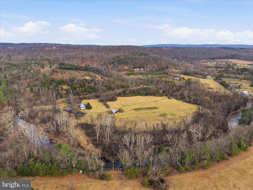 Hunt! Fish! Build! Rent! Develop! Divide! Homestead! Yes, the possibilities seem endless for this 62.5 acres with over 1,800 feet of trout stocked North River frontage. This long-time, family-farmed parcel is about to start a new chapter, & you can help write it. 3 separate septic systems, a well, & multiple structures exist providing a jumping off point for a new owner. 2 deeded right-of-ways off paved AA Rogers Rd are in use, and direct access from state road Paradise Valley Ln for future development offer 3 potential entrances to the parcel. 20 minutes from Romney, WV; 40 minutes from Winchester, VA; under 2 hours to D.C. and less than a mile to the convenience store. This is your chance to become a part of the growing Hampshire County community. Property is being offered as is/where is and interested parties must be accompanied by a WV licensed realtor.