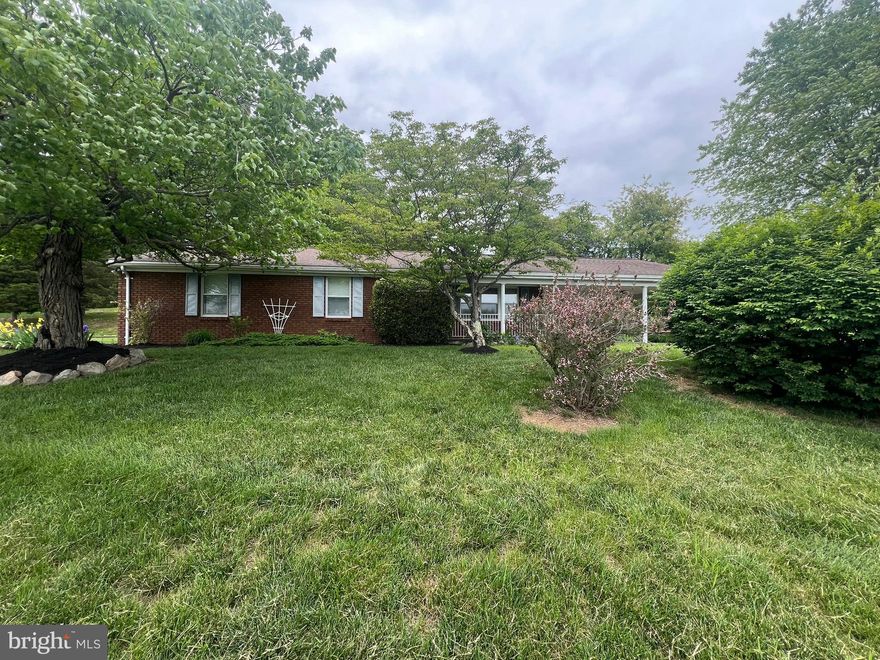 Step back in time with this beautifully preserved brick rancher built in 1979, offering a rare blend of historic charm and modern upkeep. Owned and meticulously maintained by just one family since its construction, this home exudes care and pride at every turn. From the moment you walk through the door, you'll be amazed at the pristine condition—it's hard to believe anyone has ever lived here. Featuring three spacious bedrooms and two full bathrooms, this home offers comfortable living on a full basement, providing plenty of storage or potential additional living space. The asphalt driveway leads to a convenient two-car carport, perfect for everyday use. Situated just a stone’s throw from I-70, commuting is a breeze, and you’re only five minutes from the heart of downtown Hancock. Whether you're relaxing on the covered front porch or enjoying the peaceful views from the carport, you'll be captivated by the stunning southern vistas that surround this one-of-a-kind property.