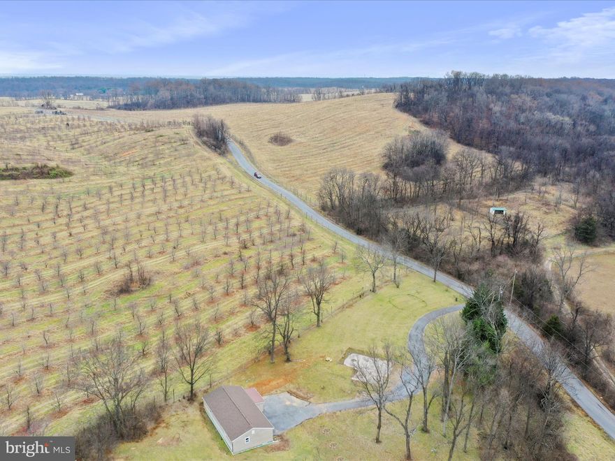 Multiple Offers Received - Best and final due by 5:00PM on 1/12. This is an exceptional opportunity to own 1.47 unrestricted acres of endless potential, located just 11 minutes from Inwood and I-81! This beautifully updated ranch home features a range of modern upgrades, including a brand new roof, a 2.5-ton HVAC unit, an exterior electric meter, and a newly installed interior electrical panel. The attic has been insulated with TAP Pest Control insulation, and the air handler for the new HVAC system has been carefully placed for efficiency. The bathroom has been fully renovated, showcasing a spacious 60 x 34 tub/shower combination, a stylish vanity, and contemporary fixtures. The kitchen has been thoughtfully redesigned with New River White Granite countertops, sleek Samsung stainless steel appliances (fingerprint resistant), and a stunning satin-brushed large single bowl sink, complete with a single-handle pull-down faucet with sprayer. The living and dining areas have been enhanced with recessed lighting, while a modern ceiling fan adds comfort to the living room. Both bedrooms also feature ceiling fans, and the entire home boasts a seamless luxury vinyl plank flooring throughout. The interior is just the beginning—step outside and imagine the endless possibilities! With no HOA restrictions, you have the freedom to transform the 1.47-acre property into your dream retreat. Enjoy the privacy provided by an orchard on one side, along with large front and side yards, perfect for homesteading, outdoor activities, or whatever your vision may be. This is your chance to own a truly unique property and make it your own!