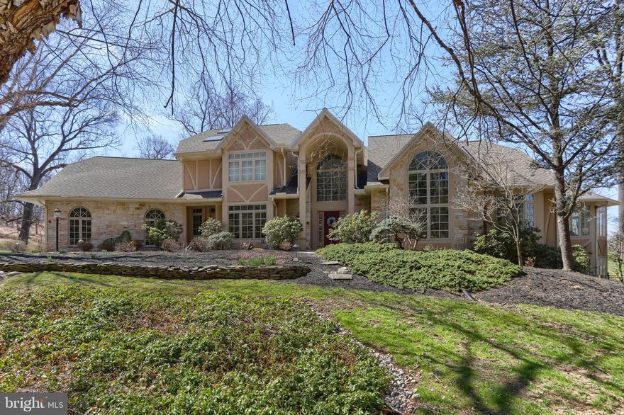 Welcome to 1345 Wyndham Road.  A rare opportunity to purchase a home in the private and secluded "The Oaks" community. This stunning home is a perfect blend of elegance and functional living space. Large open rooms bathed in sunlight and exceptional views of the countryside from every vantage point.  Sunset displays nightly with an  unobstructed view that will take your breath away.  The home is situated in the back corner of the development with complete privacy and seclusion except for the passing deer.
Spacious eat-in  kitchen features high end stainless steel appliances, work stations and an abundance of cabinetry...perfect for an intimate gathering or a gourmet extravaganza.  From the kitchen, one can traverse to the formal dining room, to the circular vaulted sunroom or outside to the fenced in sprawling back yard with  a fabulous pool and entertainment features.  The home is all about celebrating life.
First floor family room with fireplace, a private office and an expansive laundry room, all add to the functionality of the home.
Luxurious primary suite with two walk-in closets.  The vaulted primary bath with skylights features an elegant soaking tub and walk-in shower. 4 additional large bedroom and adjacent baths are also on the 2nd floor.  
High end finished walk-out lower level.  Large recreation room with bar, sitting area with fireplace and pool table.  There is also a mirrored exercise room.  A 6th bedroom and full bath add to the convenience of visiting guests. Plenty of storage throughout the home.
This stunning home is move-in ready.  Schedule your appointment now.