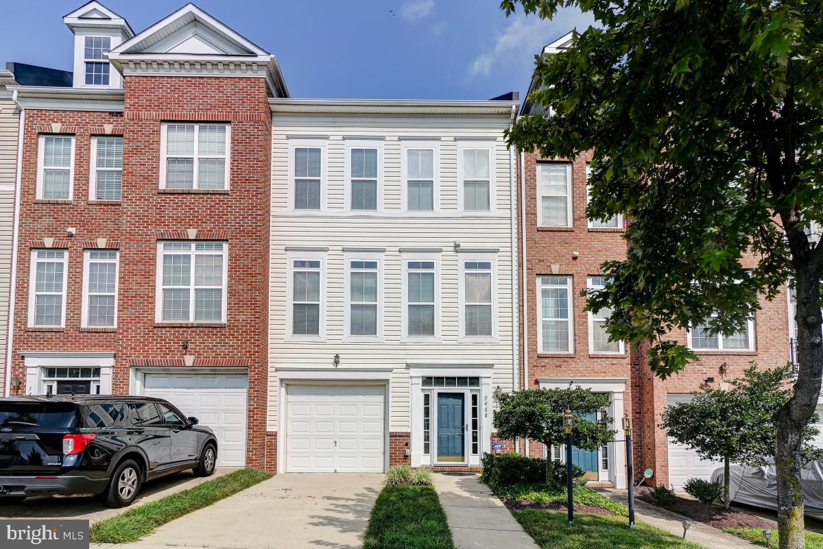 Welcome to 5408 Hartfield Avenue, an elegant and well-maintained townhome located in the desirable Town Center at Camp Springs Community. This home is spacious and offers three finished levels spread out over 2600 square feet, 3 generous bedrooms, 3.5 baths, a private deck and a one-car garage and private driveway. Enjoy the open-concept floorplan on the main level, anchored by gorgeous luxury vinyl plank/hardwood flooring, which is flooded with natural light through the large Atrium windows. The kitchen is a chef's delight and offers an abundance of cabinets, as well as a pantry, an island, sleek black appliances, granite countertops, and space for a large gathering table or a cozy seating arrangement. Upstairs, there is a spacious primary bedroom suite which includes a private bath with soaking tub/separate shower, double vanities and a huge walk-in closet. Two additional bedrooms, a full bath with tub/shower, and the convenient laundry closet with washer/dryer complete this level. Not to be overlooked is the finished lower level which contains a cozy family/recreation room with access to the rear yard, an additional full bath. utility room, and garage access. This is a gated community which offers restaurants and retail establishments. Onsite amenities (which are available through a paid membership) include a community clubhouse with controlled access, wi-fi center, media center, conference room, entertainment kitchen, fitness center, indoor basketball court/sports court, tennis courts, picnic/grilling area, kids playground, and an outdoor inground pool. Say goodbye to long commutes as this home is located within a 4-minute drive/10-minute walk to the Green Line Branch Avenue Metro Rail, as well as easy access to all major commuting routes, Joint Base Andrews, the National Harbor, Old Town Alexandria, and the District of Columbia. APPLICATION REQUIREMENTS: Minimum Credit Score: 650; Income 3 x monthly rent; Call for appointment as this home will not last long!