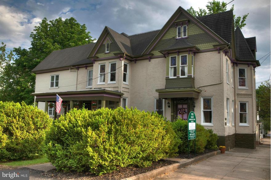 SHORT SALE REAL DEAL Brick Victorian manor house one of the nicest blocks in Martinsburg.  20+ rooms, Stained glass windows. Built-ins, orig huge doors, orig1800 log structure in basement.  Renovated w/ NEW PLUMBING, WIRING, ROOF, KITCHEN, BATHS, HVAC. Grand high paneled ceilings. HW floors. Jacuzzi. Gas boiler, log pub room / full basement. Walk to MARC, Schools Can be B&B or two family dwelling.