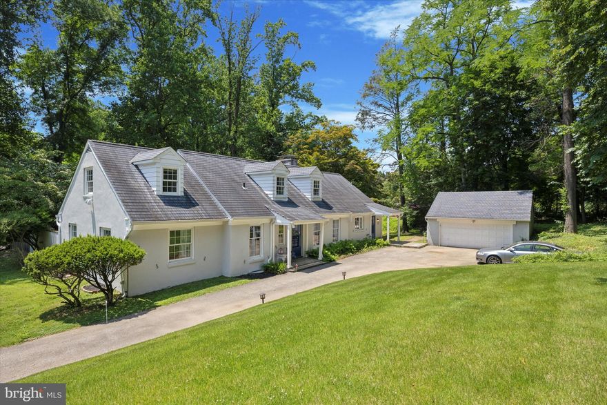 This handsome Cape Cod house is cradled on a .7-acre lot with stately trees gently sloping Southwest and near to acres of protected open space. The stucco/masonry custom house, circa 1959, with detached 2-car garage, offers four bright bedrooms and four bathrooms. Two on each floor. The entrance foyer leads to the living room with fireplace and glass sliding door that opens to a private terrace and pool. The kitchen with wood cabinets and tile back splash opens to a den with fireplace, bay window, wood paneled walls, & built-in bookcases. The formal dining room is adjacent to the kitchen.  A powder room and laundry area are located on the first floor. The house features hard wood floors, newer18 pane windows, Central Air, gas hot/air heat, and a full basement with even grade outside entrance to side brick patio. The premises is serviced by an on-site septic system & public water. AKA 213 Lynnebrook Lane