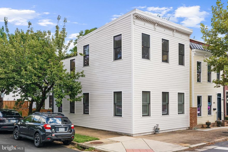 Welcome to this 2-level, 2,800+ sq. ft.  meticulous fully-remodeled Old Town townhome blending timeless historic charm with the finest modern amenities. From the moment you step inside, you'll be captivated by soaring ceilings, warm hardwood floors, original exposed brick fireplaces, and oversized windows that bathe the home in natural light. The main level is thoughtfully designed for both large-scale entertaining and intimate gatherings. It features a sun-drenched living room, an elegant formal dining room, a chef’s dream kitchen, and a comfortable family room with seamless access to the outdoor patio. Upstairs, the primary bedroom suite invites rest and relaxation with its cozy fireplace, spa-inspired full bath, and generous walk-in closet. Just down the hall, you'll find two spacious bedrooms, a full bath, and a conveniently located laundry room. Step outside to your private, beautifully landscaped courtyard with a paver patio—ideal for al fresco dining or quiet evenings under the stars. Beyond the courtyard, a detached two-car garage offers even more versatility. The garage upper-level loft has been fully finished, making it the perfect space for a home office, game room or exercise studio.  Perfectly situated just blocks from both Washington and King Streets, this residence offers easy access to stylish boutiques, acclaimed restaurants, cozy coffee shops, and popular fitness studios.  All located close to everything Washington DC has to offer;  just 4 miles to Regan National airport, Amazon's HQ2 and convenient to public transportation.