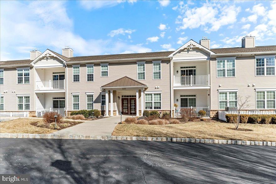 Updated, carefree living in the desirable Foxfield 55+ Community in Garnet Valley. This two-bedroom,  two-bathroom, second floor flat has an updated kitchen with white cabinetry, laminate floors throughout the open concept living/dining area which is flanked by two bedrooms.  The primary bedroom has Berber carpet, a walk-in closet and en-suite bathroom with large vanity, stall shower and full-sized linen closet. Second bedroom is adjacent to second full bathroom with bathtub. The unit has a private balcony and in-unit laundry. Take the elevator to the lower level where a private, oversized, one-car garage and additional storage closet are just a few feet from the elevator.  The community features a clubhouse with fitness center, walking trail, an outdoor pool and multiple daily activities.