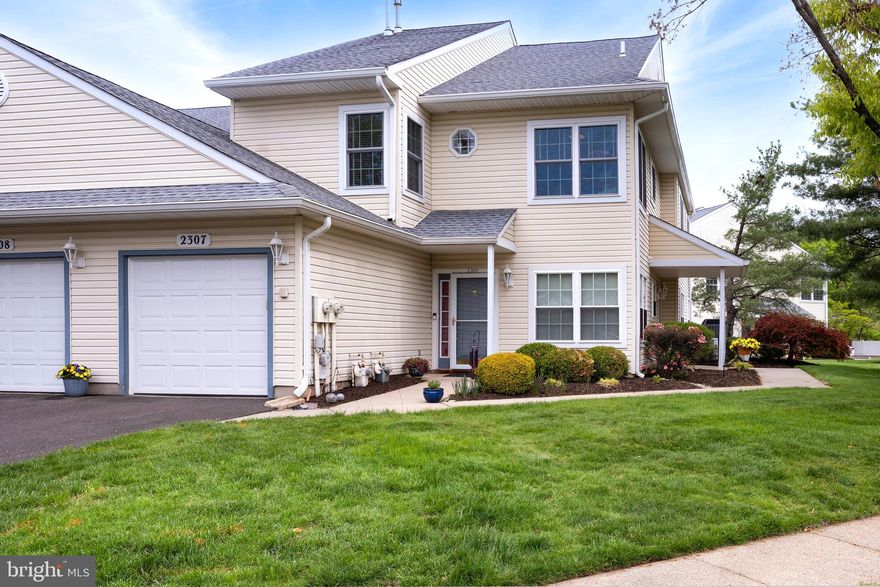 In Lower Makefield’s Brookstone Community, with a Yardley mailing address, this end-unit combines thoughtful updates with a layout that simply works. The living and dining areas are centered around a gas fireplace, creating a comfortable gathering space, and are open to a generously sized balcony overlooking a common green area below, offering a peaceful, open outlook that feels removed from parking and traffic. The kitchen has a welcoming, almost charming feel, with glass-front cabinetry, stainless steel appliances, and a breakfast nook filled with morning sun thanks to its corner windows, making it an easy favorite spot to start the day. Updated flooring runs through the home and adds a clean, cohesive look. There is also in-unit laundry along with a one-car garage that opens into the unit. The primary bedroom includes a walk-in closet with custom organizers and an en-suite bath featuring a double-width, glass-paneled shower with a pebble tile floor and a skylight above. The hall bathroom has been updated with an air tub, offering a comfortable place to spa at home. With three bedrooms total, the home offers flexibility for a variety of needs, whether that is guest space, a home office, or both. The Brookstone community is well-equipped for residents and visitors alike, with plenty of parking, a pool, tennis courts, and a clubhouse, making it easy to enjoy time close to home.