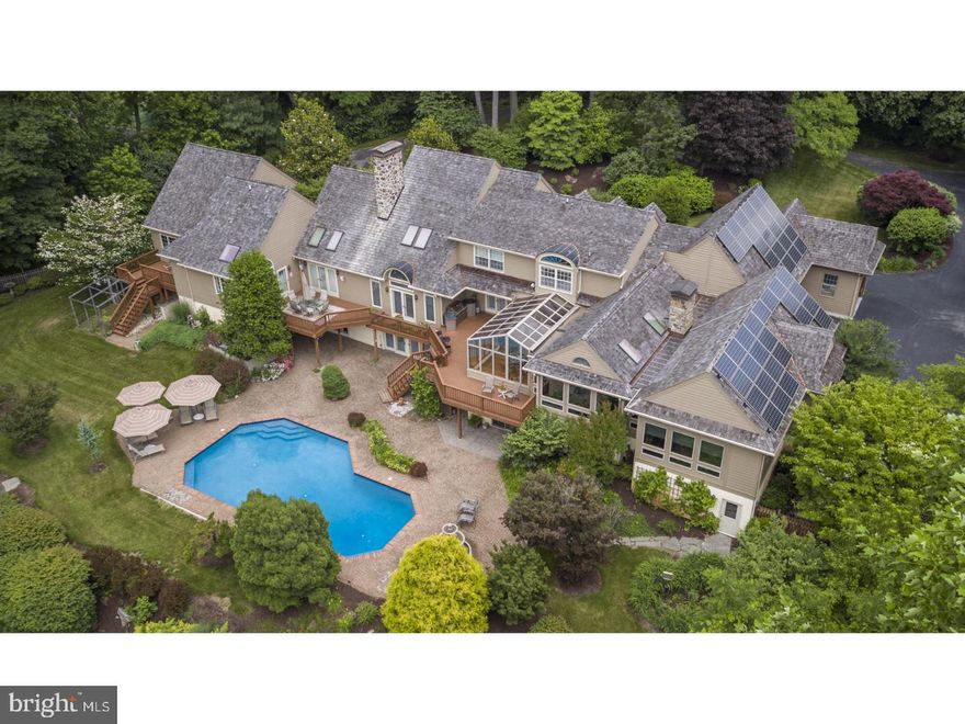 Set on an exceedingly private 4.3 acre lot, rising from the Brandywine River hillock above, with sweeping views to the Cheslen Preserve beyond, where sits this spacious 4 Bedroom, 4.1 Bath home in the sought after Unionville-Chadds Ford School District. The first floor features a gracious Foyer with a curved staircase, custom French floor tiles, and leads to a dramatic Great Room with a floor-to-ceiling stone fireplace, pegged oak floors, wet bar, and access to a rear deck overlooking the pool and preserved open space. Additionally, there is a Den with walls of rich cherry raised paneling, a large Dining Room overlooks the Great Room and also accesses the rear deck. Cooks will love the adjoining Kitchen with newer high-end appliances and loads of granite - all adjoining a newer Atrium which serves as a fabulous Breakfast Room. A Sun Room and a Sitting Area with a stunning brick fireplace both lead to a jaw-dropping Family Room with loads of glass and cathedral ceiling. Also found on the main level is a truly unequalled Master Suite that features a Bedroom with a fireplace and a wall of raised paneling, three walk-in closets, a luxurious Bath with lots of glass and heated marble floors. Also included in the Master Suite is a large Exercise Area with a pool with a swim current. Downstairs is a second Family Room, Changing Room, and full Bath with direct access to the pool and patio. Additionally, there is an Office, and plenty of additional space that could easily be transformed into a fabulous in-law suite. Some of this space is currently a pottery studio. On the upper level are three Bedrooms, two full Baths, and access to additional bonus space over the Garage. Add to all these phenomenal features geo-thermal heating and cooling, solar panels on the south roof, three car Garage, 2 x 6 construction, stunning landscaping, loads of newer improvements, and award-winning schools - this fine home represents one of the best values on the market in Chester County.