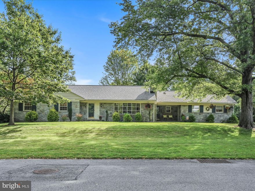 Offer in hand.  Deadline is 3 pm on September 7.   Beautiful Atglen quarry stone ranch home in highly desirable neighborhood.  Within walking distance to Elizabethtown College, Elizabethtown Middle School and High School as well as East High Elementary!  Home sits on a .82 acre lot nestled in a neighborhood of large mature oak and maple trees.  The larger than normal set-back from a dead-end road, with minimal traffic, makes for a very quiet, relaxing setting.  This home offers 4 or 5 bedrooms, 4 updated baths, with plenty of space for an in-home office for remote occupations if needed.  The cherry cabinetry kitchen is very functional with a bar top counter transition to a full dining room.  You'll find a hardwood floor in the dining room and French doors that lead to the 14' x 10' sunroom.  With the wood finishes and flagstone floor, this space feels like it came straight out of Colorado.  The spacious living room with built in cabinetry is flooded with light and a wood stove fireplace insert.  The walkup attic offers an additional 1,300 sf of storage space!  The walk-in cedar closet and other large closets offer even more storage room.  The huge lower level with ample natural outdoor light exposure is where you will find bedroom 4 and 5, in addition to a wide open space with pool table, table tennis, home theater and other recreational equipment to remain with the home if desired.  Basement also comes complete with a wet bar, floor-to-ceiling stone wood burning fireplace, additional built-in cabinetry with bookshelves, and more!  The heat pump, with oil hot-water baseboard back-up and wood stove, makes heating the home rather economical.  Moving outside you'll find a flagstone patio and walks with a large private back yard for great outdoor entertaining and all kinds of activities.  The huge 25' x 28' rear-entry garage offers many options for storage or a workshop.  Rear-entry to the garage also has a large private parking area for multiple cars, huge recreation area to play basketball, or to set up a portable pickleball net.  The sellers have even shown outdoor movies on the garage door!  Don't hesitate to add this home to your tour today, you won't regret it!