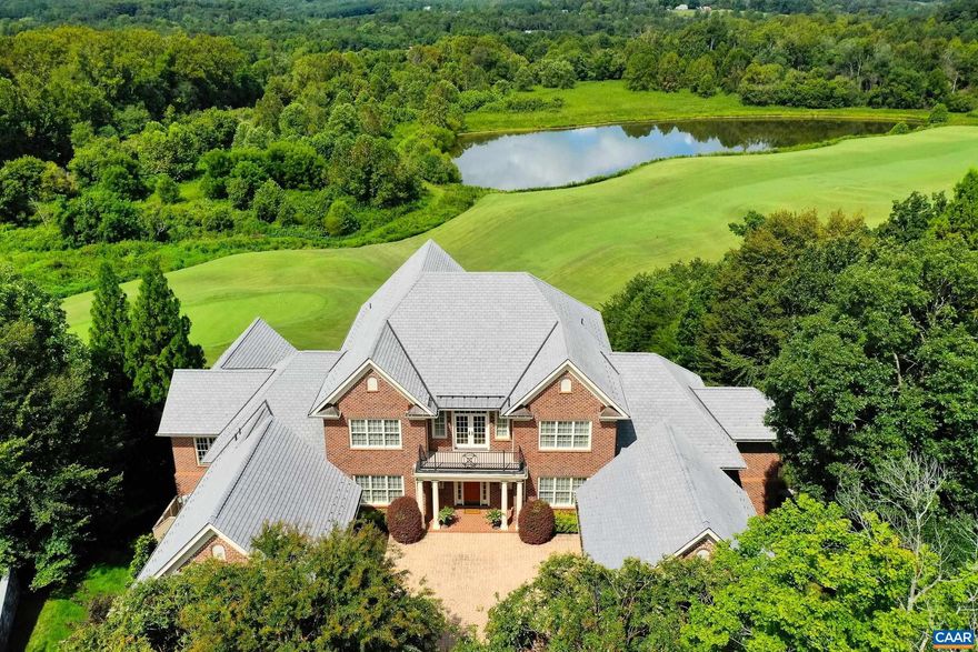 The former owner of Glenmore Club chose this location to build this exceptional, luxury estate. Why? This homesite overlooks the 17th hole of the golf course, the Rivanna River and Monticello! One could say this home offers the best views in all of Keswick and Glenmore. Enjoy the views with Pella windows and expansive back deck and terrace. Luxury abounds in this custom home designed for easy entertaining and great comfort.No expense was spared in this home including hardwood floors throughout main level, coffered ceilings, built ins and travertine surrounded gas fireplace in great room.Kitchen includes cherry cabinets, honed granite countertops, and top-of-the-line stainless steel appliances. Primary suite is a retreat with its own fireplace, sitting area, spa-like bathroom, custom shower, and incredible walk-in closet. A second main-level accessible suite is perfect for aging parents or guests. Upstairs, you?ll find four large bedrooms, each with ensuite bathrooms.  The terrace level is an entertainers dream! A large rec room with pool table and gorgeous stone fireplace, wine cellar for 500+ bottles, huge workout room and home theater.  Outdoor spaces are so inviting with expansive deck and professionally landscaped yard.,Cherry Cabinets,Granite Counter,Fireplace in Great Room,Fireplace in Master Bedroom,Fireplace in Rec Room
