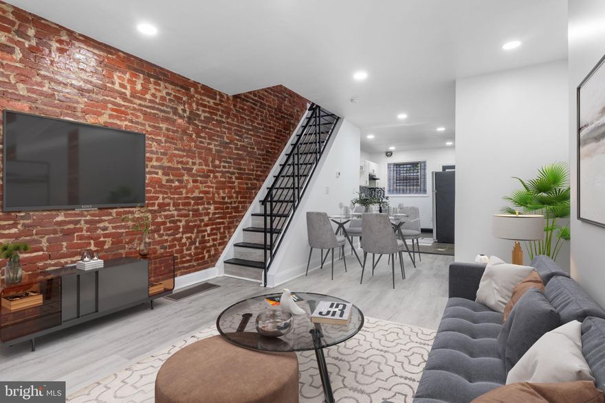 Welcome to 3342 Palethorp Street! Step inside this newly renovated 3-bedroom, 1.5-bath home that perfectly blends modern style with classic charm. The first floor features an open layout with exposed brick walls, black accent finishes, HVAC unit for year round comfort, and a convenient half bath for guests. The kitchen shines with granite countertops, sleek cabinetry, and stainless steel appliances—ideal for cooking and entertaining. Upstairs, you’ll find three comfortable bedrooms, including a master suite with stylish barn doors leading to a spacious closet. The full bathroom offers a glass stand-up shower with contemporary tile work, adding a luxurious touch. With thoughtful finishes throughout and move-in-ready updates, this home is perfect for first-time home buyers  looking for comfort, style, and value.