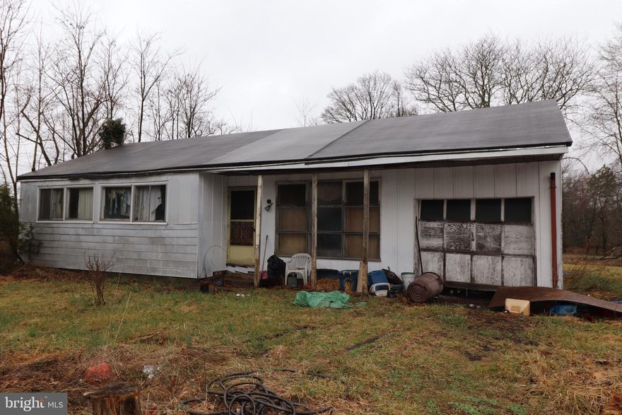 Great corner property for a new home to be built.  This is a tear down according to the owner.  This property is being sold as is.  Owner will not make any repairs of any kind.  Owner will remove the truck and some items in the house.  The remaining items will be the buyers responsibility including any permits, inspections or U&O.