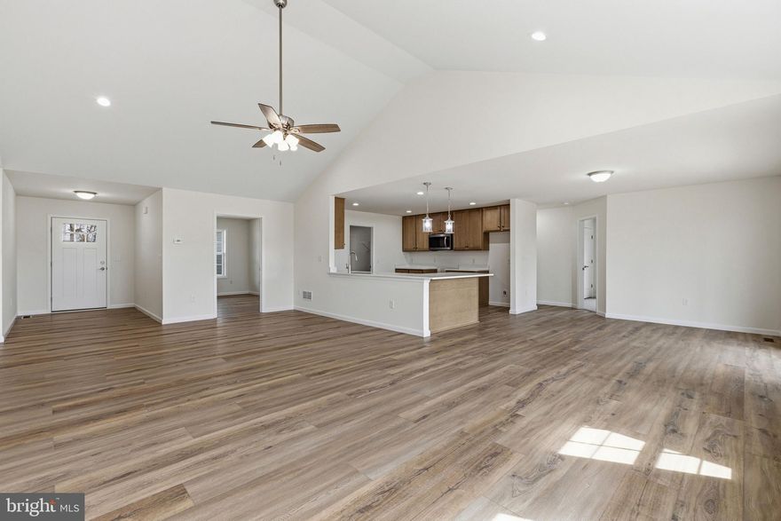 You won’t want to miss this brand-new custom home that's Move in Ready! Offering 2,100 square feet of thoughtfully designed living space, this home sits on a spacious 0.84-acre lot, conveniently located near Route 1, Route 113, and the Delaware beaches. Inside, you’ll find 3 bedrooms and 2 full bathrooms with an open, airy floor plan perfect for both everyday living and entertaining. The large kitchen features stainless steel appliances, quartz countertops, and 42" cabinetry, and opens seamlessly to the dining area and expansive family room. A dedicated home office adds flexibility for today’s lifestyle. The primary suite is a private retreat, complete with a 4-piece en-suite bath offering a soaking tub, separate shower, dual vanities, and a generous walk-in closet. Step outside to enjoy gatherings or quiet evenings on the rear covered patio, overlooking the expansive backyard. Schedule your private tour today and make this beautiful new home yours!