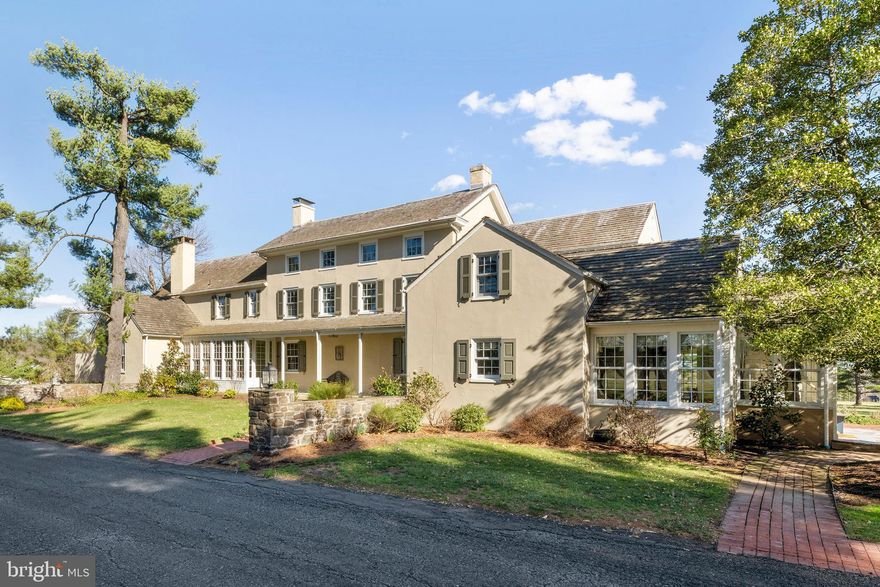 “New Song” This beautifully maintained 5 Bedroom, 4.1 bath plaster over stone farmhouse (circa 1854) is one of the first homes you see when rounding the bend on this  country Doylestown road.    Along with the main farmhouse, which has been expanded and updated ongoingly, the property offers a stone ice-house and spring house, barn/workshop building with 2 horse stalls, detached 3-car garage with carriage doors, additional storage building, and the original cedar-sided silo.  Sweeping views to the rear allow for extreme privacy, and there is plenty of room for a pool, sports of any kind, animals or a few horses on this level, open, expansive property.  The main home,  was expanded in the 1930’s-1940’s and is finished with vintage pumpkin pine, heart pine, and oak wide board floors and newer cherry floors in the kitchen, 3 fireplaces, deep sill windows, tall ceiling height, two staircases, and generous room sizes on all three living levels.  This fine home also allows for two en-suite main bedroom wings, if desired. Close to the kitchen area, which offers a butler’s pantry area and cozy windowed breakfast nook, is the gracious dining room.  This stunning banquet-sized dining room features the original wood fireplace with chestnut lintel, and has been enhanced with two walls of French doors that lead to the wrap-around screened porch and flagstone patio-both perfect for outdoor entertaining! The living room is finished with a vintage pine paneled wall, stone & wood fireplace with an oak mantel, random oak floors and plenty of built-ins. Nearby is a comfortable family room with stone fireplace, and  powder room, tucked under the stairwell.  A handsome home office with vaulted open beamed ceiling & custom Edwardian paneling has its own separate glass enclosed entrance vestibule with flagstone flooring, ideal for greeting business associates right at home. The second floor offers 3 spacious bedrooms, each with its own tile bath. One has been newly updated with a marble shower with frameless shower doors.  There is also a sewing or computer room, laundry and ample closet space. The charming third floor offers two additional bedrooms and one bath, along with eyebrow windows and convenient walk-in attic storage.  Natural light is abundant throughout! The basement is clean, dry, well-insulated and outfitted with the best of utilities and mechanicals- 3 zones of geothermal HVAC (6 wells), 400 Amp. electric service, a whole house propane generator, new hot water heater, radon remediation system, and more.  Outside, the barn/workshop building boasts 1000 sq. ft of space with a tall, vaulted ceiling and double doors at each end - ideal for the hobbyist - with ample storage for large vehicles or boats – and with a little TLC, the barn offers two nice stalls & a storage/hay loft.  The numbers of improvements on this perpetually improved vintage home and property are remarkable, including a new eco-friendly  drip irrigation septic system (approved and soon to be installed), new windows, new brick walkways, new roof on the barn & portions of the home, new garage doors w/remotes, new siding, new painting inside and out, and a new bonus parking area opposite the house- the list goes on!  This inviting and much-loved farm allows privacy, convenience, Central Bucks Schools,  and most of all, the opportunity to enjoy fun with family and friends for years to come!