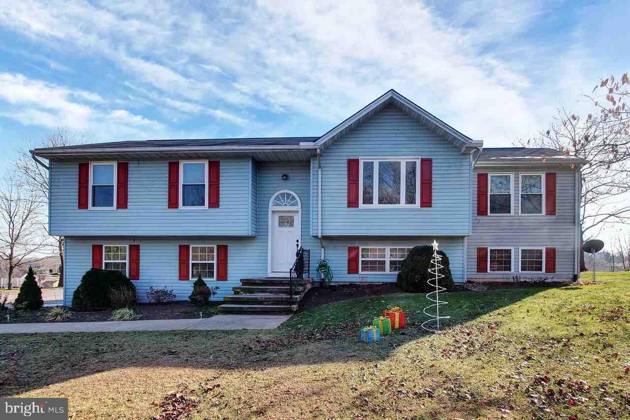 BEAUTIFUL COUNTRY SETTING. 4BR, 2BA SPLIT FOYER WITH 2 CAR GARAGE AND COVERED DECK. ALL NEW WINDOWS ON FRONT OF HOME. VERY NICE SHED AND PLAYSET CONVEY. FINISHED LOWER LEVEL WITH FAMILY ROOM AND BR OR CRAFT/HOBBY ROOM.