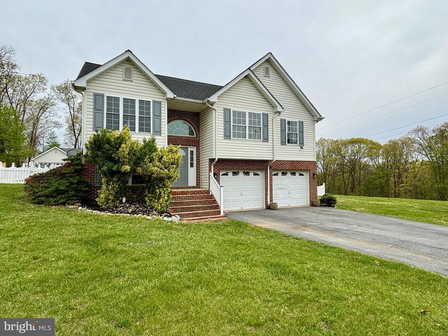 Newly renovated and very spacious split foyer in Forest Heights!  Your new home offers Luxury Vinyl Plank through the entire house including the stairs!  The kitchen offers new white shaker cabinets with quartz countertops and stainless steel appliance package.  Updated bathrooms and lights throughout.  Composite deck with a vinyl fenced yard.  Plenty of parking and yard space with 2 car garage.  Check it out today!