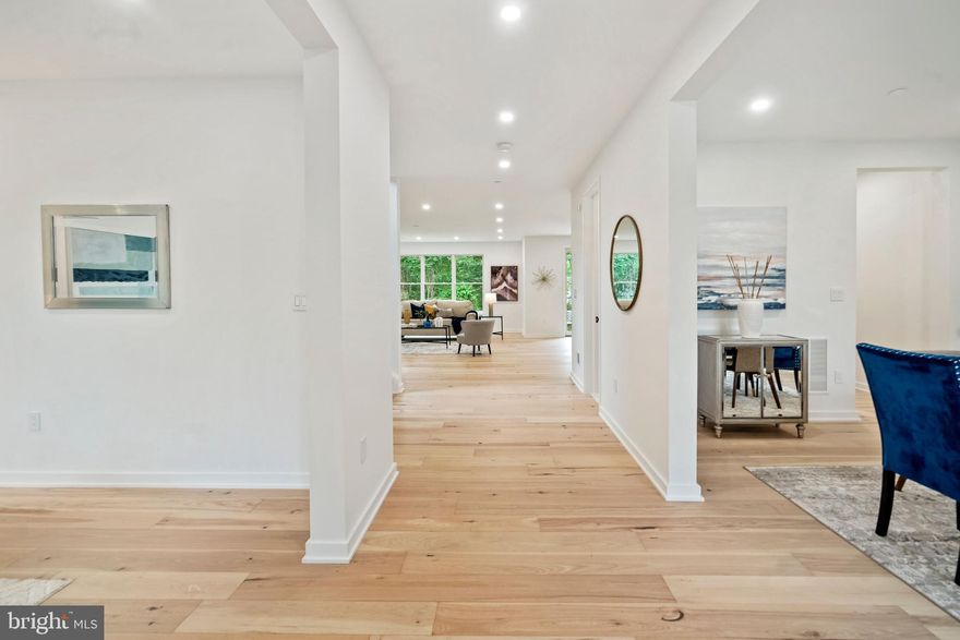 Welcome to 8704 Ewing Drive in the highly sought-after Bradmoor Community of Bethesda, MD. A stunning, modern, and contemporary residence featuring 5,596 sqft of living space including 5 Bedrooms, 5 Full-baths, 1 Half-Bath, 2 Offices, Living Room, Family Room, Dining Room, Kitchen, Pantry, Mudroom, Pet Washing Area, Exercise Room, Multi-Purpose Flex Space, 2-Car Garage, Patio, and a large Yard ready for entertaining.  Newly built in 2022 by Award-Winning Axis Builders and lovingly maintained, this gorgeous residence is move-in ready and perfect for comfortable living and formal entertaining alike. 

The residence boasts abundant natural light and a gracious flow throughout the main level with well-proportioned living spaces accented by gleaming hard wood floors, high-ceilings, and an electric-fireplace with the capability to be converted to gas. The dining room can easily accommodate a large table with seating for 12 guests. The large Chefs kitchen features quartz counter tops, stainless steel appliances with 2-dishwashers, a comfortable space for casual eat in dining with direct access to the patio and an expansive yard.  In addition, the main level houses a formal sitting area and/or an office, a butler’s pantry, a powder room, a mud room/doggy pet washing station and a 2-car garage. 

The Upper Level houses the Primary Bedroom Suite, Primary Bath Suite, his & her separate walk-in closets, three (3) additional bedrooms with three (3) ensuite-full baths, another room that can be an office, nursery, and easily converted into a 5th bedroom, and a laundry room.

The lower level offers a large living flex/multipurpose space, one (1) additional bedroom and one (1) full bath, another office/gym/exercise room, a wet bar, and a storage room. 
Builder & Subcontractor Warranty – (1-Year) Free of defect in materials & workmanship – (2-Years) Free of defect in electrical, plumbing, heating, cooling, ventilation, & mechanical systems – (5-Years) Free of any major structural defects.

Minutes from downtown Bethesda, Bethesda Row, Bethesda Metro, 495 and all major highways & shopping. Walt Whitman High/Thomas Pyle Middle/Bradley Hills Elementary Schools.