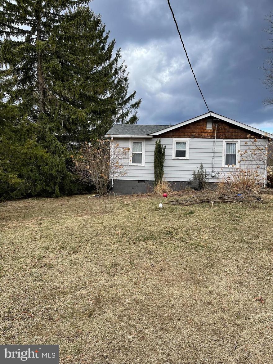 Back on the market because buyers financing fell through. Priced under current FHA appraisal. . Charming 2-bedroom, 1-bath rancher nestled in a private setting, perfect for first-time homebuyers, downsizers, or as an investment rental. This home has been thoughtfully updated with a newer roof, newer well pump, water softener, replacement windows and doors and a completely remodeled bathroom. Enjoy year-round comfort with a new heat pump. The spacious front porch is ideal for relaxing with morning coffee, while the newly added patio offers additional outdoor living space. A wonderful opportunity to own a move-in-ready home in a peaceful, serene location!