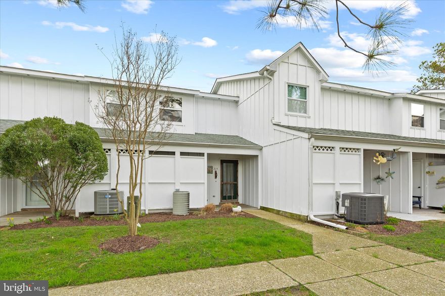 Discover your ideal beach retreat in this coastal Waterfront villa, being sold furnished, located in the picturesque, amenity-rich community of Mallard Lakes. With its crisp white board-and-batten exterior and inviting covered porch, this home immediately sets the tone for relaxed waterfront living.

Inside, warm wood-accented walls create a welcoming and comfortable atmosphere, perfectly complementing the coastal setting. The kitchen is thoughtfully designed with a functional work triangle, ample cabinetry, and a convenient breakfast bar for casual dining. A nearby powder room adds ease for guests. The adjoining dining area flows seamlessly into the living room, where a cozy wood-burning fireplace creates an inviting space to gather and unwind.

Sliding glass doors lead to a screened porch that truly feels like you are sitting right on the water. Here, you can take in sweeping lake views and the surrounding natural beauty, making it the perfect spot for morning coffee, evening relaxation, or quiet reflection. An outdoor shower adds a practical coastal touch, ideal after a day at the beach.

Upstairs, the spacious primary bedroom offers peaceful lake views and easy access to a well-appointed hall bath featuring a tub and shower combination. A large soaking tub sits beneath a skylight, filling the space with natural light and creating a spa-like retreat. A second bedroom at the front of the home provides comfortable accommodations, complete with a charming bump-out window area and generous closet space. Additional storage is available in a sizable exterior closet, perfect for keeping beach and recreational gear organized.

Residents of Mallard Lakes enjoy an impressive array of amenities, including two swimming pools, tennis and basketball courts, playgrounds, volleyball, shuffleboard, horseshoes, and picnic areas. The community also offers opportunities to fish, crab, or relax along a small sandy beach overlooking the pier.

Conveniently located just a short drive from Fenwick Island and Ocean City, you’ll have easy access to miles of beautiful beaches, scenic parks, shopping, dining, and coastal attractions. Whether you are seeking a full-time residence, vacation home, or investment property, this waterfront villa offers the perfect opportunity to embrace the coastal lifestyle.