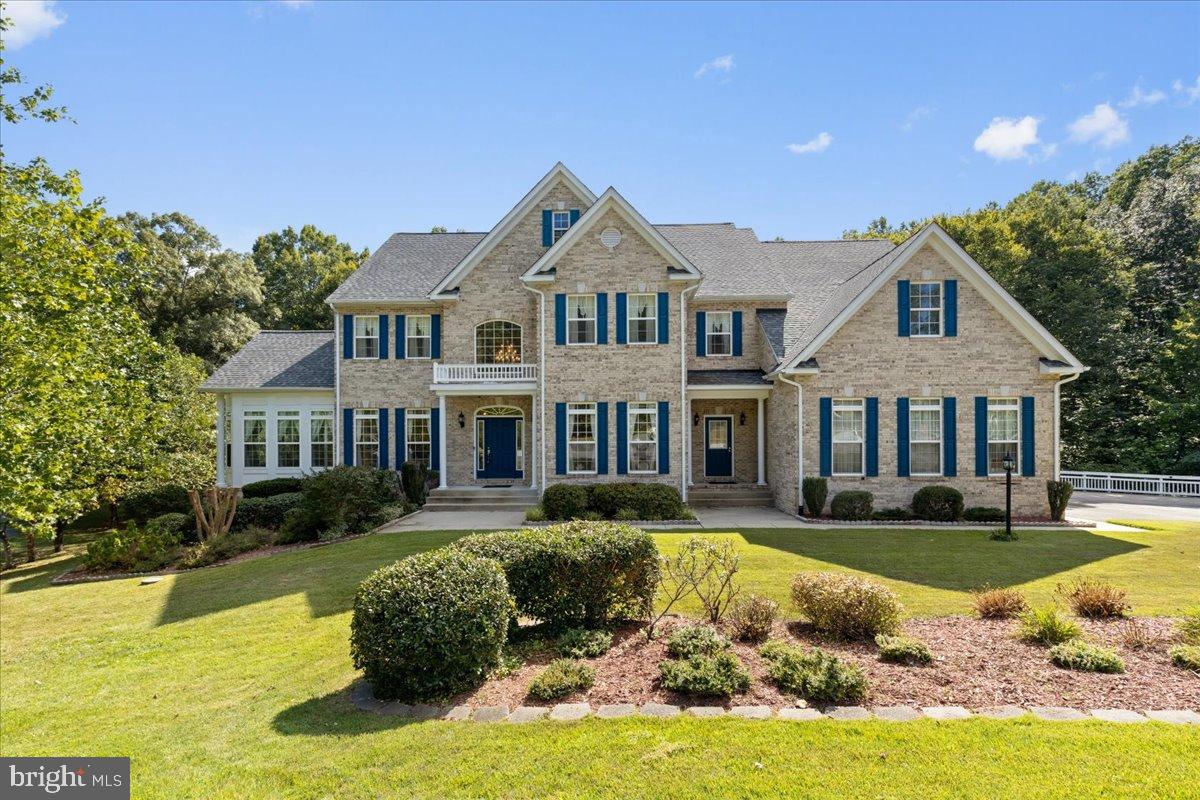 Nestled in a serene enclave, this exquisite Colonial residence embodies the perfect blend of elegance and comfort. Built in 2006, the home boasts a stunning brick front façade that invites you into a world of luxury. Spanning over 5 spacious bedrooms and 5.5 bathrooms, this meticulously designed property offers ample space for both relaxation and entertainment. Step inside to discover a fully finished daylight basement, perfect for hosting gatherings or enjoying quiet evenings by the fireplace. The inviting warmth of the living spaces is complemented by thoughtful architectural details that enhance the home's charm. With a side-entry garage accommodating three vehicles, convenience is at your fingertips. Set on an expansive 0.82-acre lot, the outdoor space provides a canvas for your personal oasis, whether it's a lush garden or a tranquil retreat. Security features, including an electric alarm and surveillance system, ensure peace of mind while you enjoy the luxurious lifestyle this home offers. Experience the joy of living in a community that values privacy and sophistication, all while being just moments away from local amenities. This property is not just a house; it's a place where memories are made, and dreams are realized. Embrace the exclusive lifestyle that awaits you in this remarkable home.