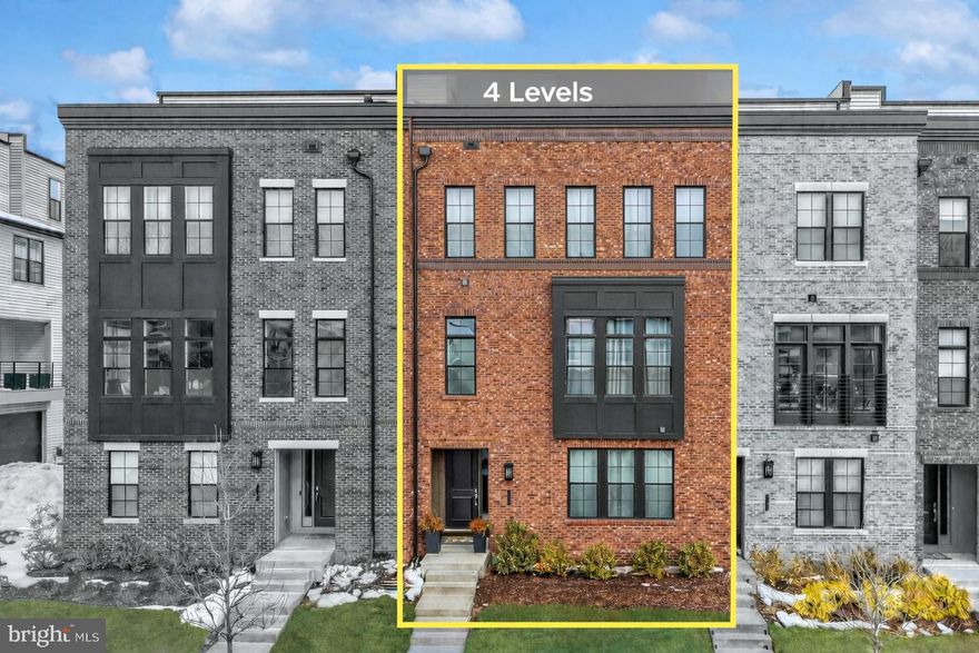 ****Seller offering concessions with the right offer. ****

Step into elevated living at Metro Walk at Moorefield Station, where modern design, refined upgrades, and everyday convenience come together in one exceptional four level residence. At 23 feet wide, this home offers an expansive feel rarely found in townhome living.

From the moment you enter, you experience the difference with luxury vinyl plank flooring, hardwood stairs throughout, and light filled spaces designed for both comfort and sophistication. The entry level offers a private bedroom with full bath, ideal for guests, multigenerational living, or a secluded work from home retreat.

Designed for connection and entertaining, the home features impressive 10 foot ceilings that enhance the sense of openness and natural light, creating an airy, refined atmosphere throughout the main living areas. The chef’s kitchen is both stunning and functional, showcasing Silestone countertops, a full backsplash, upgraded cabinetry, premium KitchenAid stainless steel appliances, a gas cooktop, and matte black fixtures. Whether hosting friends or enjoying a quiet evening in, this space adapts effortlessly to your lifestyle.

The bedroom level offers spacious retreats with walk in closets and upgraded spa inspired baths, complete with designer tile, quartz counters, and refined finishes. A conveniently located bedroom level laundry area adds everyday practicality without sacrificing elegance.

At the top, the fourth level transforms into your private escape with an expansive loft, wet bar, beverage center, and integrated speaker system, ideal for entertaining or creating the ultimate movie and recreation room. This level opens to covered and uncovered rooftop terraces, perfect for morning coffee, sunset gatherings, or relaxed evenings under the stars.

The two car garage with epoxy flooring provides polished functionality, while the community delivers resort style amenities including parks, clubhouse, pool, fitness center, amphitheater, and green spaces designed for connection and leisure.

This is more than a home. It is a lifestyle upgrade.

Residents also enjoy access to Westmoore, a premiere neighborhood known for its exceptional amenities, including two large parks with open green spaces, two playgrounds, an amphitheater, dog park, pavilion, clubhouse, community pool, and fitness center. Conveniently located near Broadlands Marketplace, Loudoun Station, and everyday conveniences, this home also offers quick and easy access to the Dulles Greenway, Route 7, Route 28, One Loudoun, and Dulles International Airport. With the Silver Line Ashburn Metro Station just steps away, commuting and travel are seamless.

This exceptional home delivers upgraded finishes on every level, flexible living spaces, premier community amenities, and one of the most connected locations in Loudoun County, a rare opportunity to own luxury living at its finest.