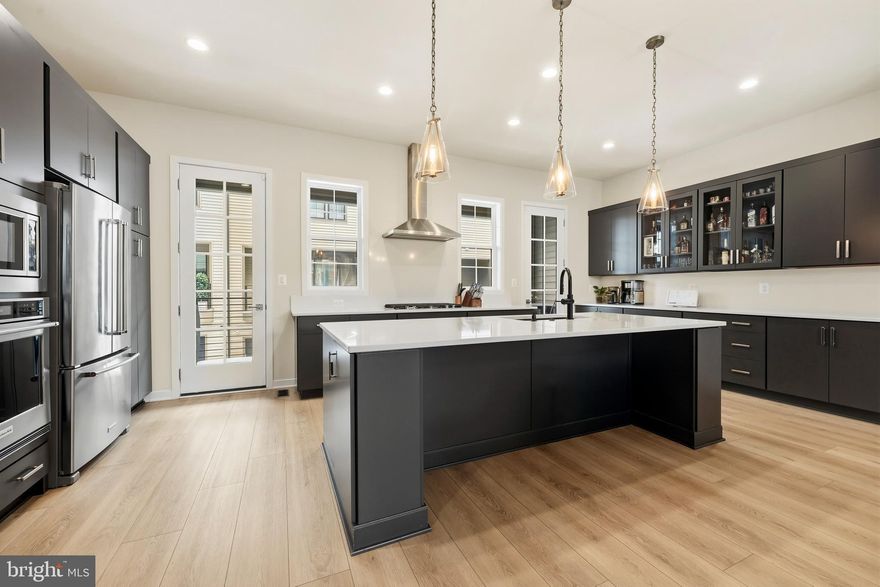 If you’ve been waiting for something that actually feels different, this is it.

This four-level townhome in Metro Walk at Moorefield Station isn’t just newer construction, it’s thoughtfully designed for the way you really live. Built in 2023, this home offers four spacious bedrooms, multiple living areas, and the kind of layout that gives everyone their own space without feeling disconnected.

The main living level feels open and elevated, with high ceilings and a full-width design that makes the home feel wider than most townhomes in the neighborhood. The kitchen flows effortlessly into the living and dining areas, making it perfect for weeknight dinners or hosting friends.

Upstairs, the bedrooms are generously sized, and the laundry is right where you need it. no hauling baskets up and down stairs. The primary suite feels like a true retreat after a long day.

And then there’s the fourth level. Whether you turn it into a movie room, game space, or entertaining lounge, it’s already equipped to impress. Step outside to your rooftop terrace — your own private escape for morning coffee, sunset views, or hosting under the stars.

All of this just minutes from the Ashburn Metro, One Loudoun, commuter routes, dining, and shopping, without sacrificing the quiet, residential feel. If you’ve been looking for newer, move-in ready, spacious, and close to everything, this one deserves a look.