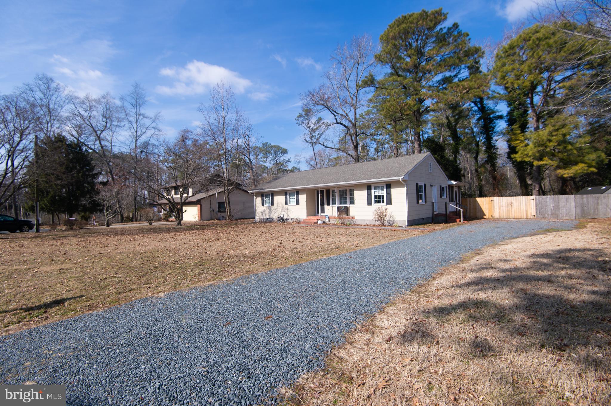 Adorable move-in ready 3B | 1.5BA ranch nestled on just under 1-acre in the outskirts of Salisbury city limits! This spacious home welcomes you into a cozy formal living area and opens to a spacious eat-in chef's kitchen. Located off the kitchen is a half bath and additional living / den space that is perfect for an office space, guests, playroom, or in-law suite! The outdoor space is complete with an oversized screened porch, private picket fence, and a new concrete patio creating a serene setting for activities and entertaining! Additional updates include fresh paint through, a beautiful new laundry / mudroom, septic system in 2017, and HVAC in 2020. Fabulous location with easy access to local amenities, schools, and parks, as well as close proximity to bypass for easy commuting, this home has it all!