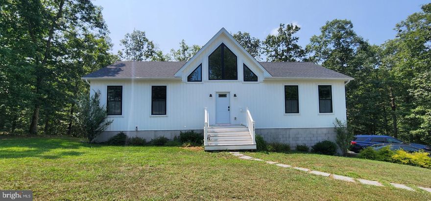 Modern One-Level Living with Room to Grow! Welcome to 249 Fairview Oaks Lane in Berkeley Springs, WV—a beautifully designed one-owner home built in 2023 with an open floor plan and endless potential! This move-in-ready home features a stylish kitchen with stainless steel appliances, white cabinetry, granite countertops, and gray luxury vinyl plank flooring throughout the main living areas.  Enjoy the convenience of an oversized (20' x 27') two-car garage with door openers and a pedestrian door for easy access. The full walkout basement offers the perfect opportunity for future expansion, complete with a rough-in bath for added flexibility.  Nestled in a quiet cul-de-sac with easy access to Route 522 and I-70, this home combines modern comfort with a prime location. Don’t miss your chance to make it yours!