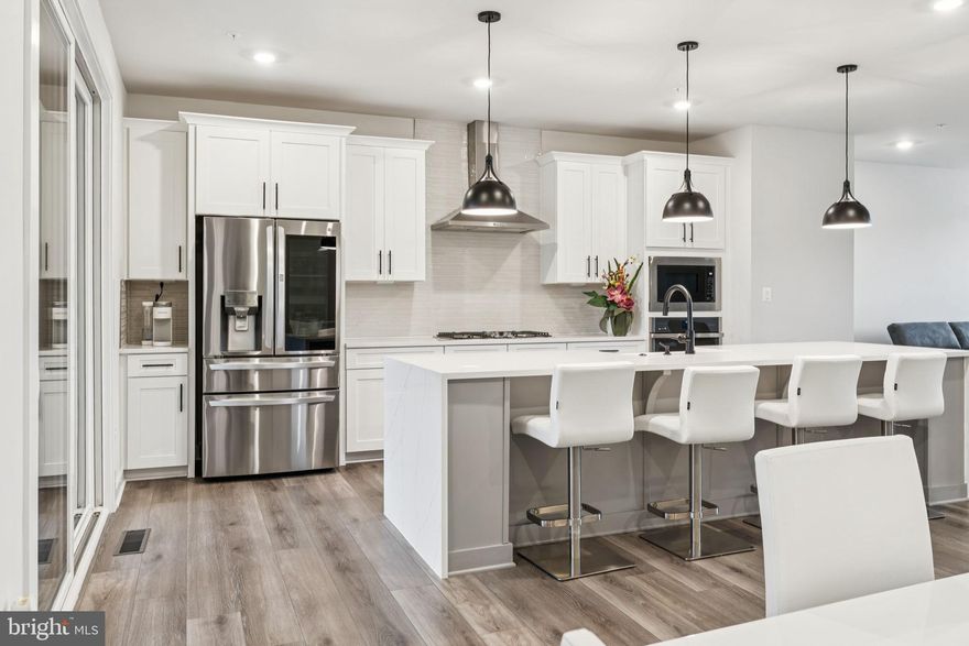 MORE OPTIONS, UPGRADES & EXTRAS THAN THE MODEL HOME! ...OVER $110,000 WORTH! ...featured in this lightly lived in 2,894 square foot Woodley Park model! 

Enter either thru your 2-car garage or sleek front door where luxury vinyl plank flooring welcomes you to your practical entry way featuring a convenient mud room bench, powder room and lower-level recreational room that looks out to your wooded serene oasis. 

The glamorous, gourmet kitchen presents a stunning 4-seater Quartz waterfall edge island with overhead pendant lighting and farmhouse sink. The beautiful, glass, mosaic backsplash is the backdrop of the generous energy efficient stainless steel appliance package: LG Thin Q refrigerator, range hood w/36" wide 5-burner gas cook top, built-in microwave & wall oven and dishwasher. Several, additional kitchen conveniences include high-end touch faucet, garbage disposal, island pop-up electrical outlet, soft close drawers/cabinetry and tucked away pantry. 

Walk into your eye-popping primary bedroom with tray ceiling, walk-in closet and ensuite spa-like luxury bathroom. Bath features double sink Quartz countertops, upgraded tile in the oversized bench shower with dual shower head/mechanics, and water closet. Natures wooded view is the background to these private spaces of yours. 

Just outside of the primary suite is the conveniently placed laundry room containing the energy efficient LG front loading washer/dryer set. Bedroom 2 w/balcony & walk-in closet, Bedroom 3 w/walk-in closet and hallway bath containing double sink Quartz countertops and bench shower with upgraded tile complete this level.

Extend your entertainment space onto your nearly new composite deck featuring a remote-controlled automatic screen to separate the patio space that features a stylish, stone fireplace and ceiling fan. 

Custom window blinds and recessed lighting throughout. Ceiling fans w/remotes in each bedroom. 

"Extra, Extra. Read All About It!"... Garage stainless steel GE refrigerator, Deck & Patio furniture sets (2) w/Propane fire pit table & Umbrella, Charcoal grill, 2nd bedroom Cafe patio set & Wall mount TV brackets. Bonus: Home Warranty :-)

CHECK OUT RECENTLY SOLD PROPERTIES IN THE COMMUNITY THRU PUBLIC RECORDS!
13845 Hunt Valley Ct - $848,799 - 12/16/24, 13825 Hunt Valley Ct - $812,758 - 04/23/24, 13831 Hunt Valley Ct - $804,539 - 04/08/24, 13817 Hunt Valley Ct - $797,113 - 04/18/24, 202 Hickory Hollow Ct - $793,128 - 12/19/24