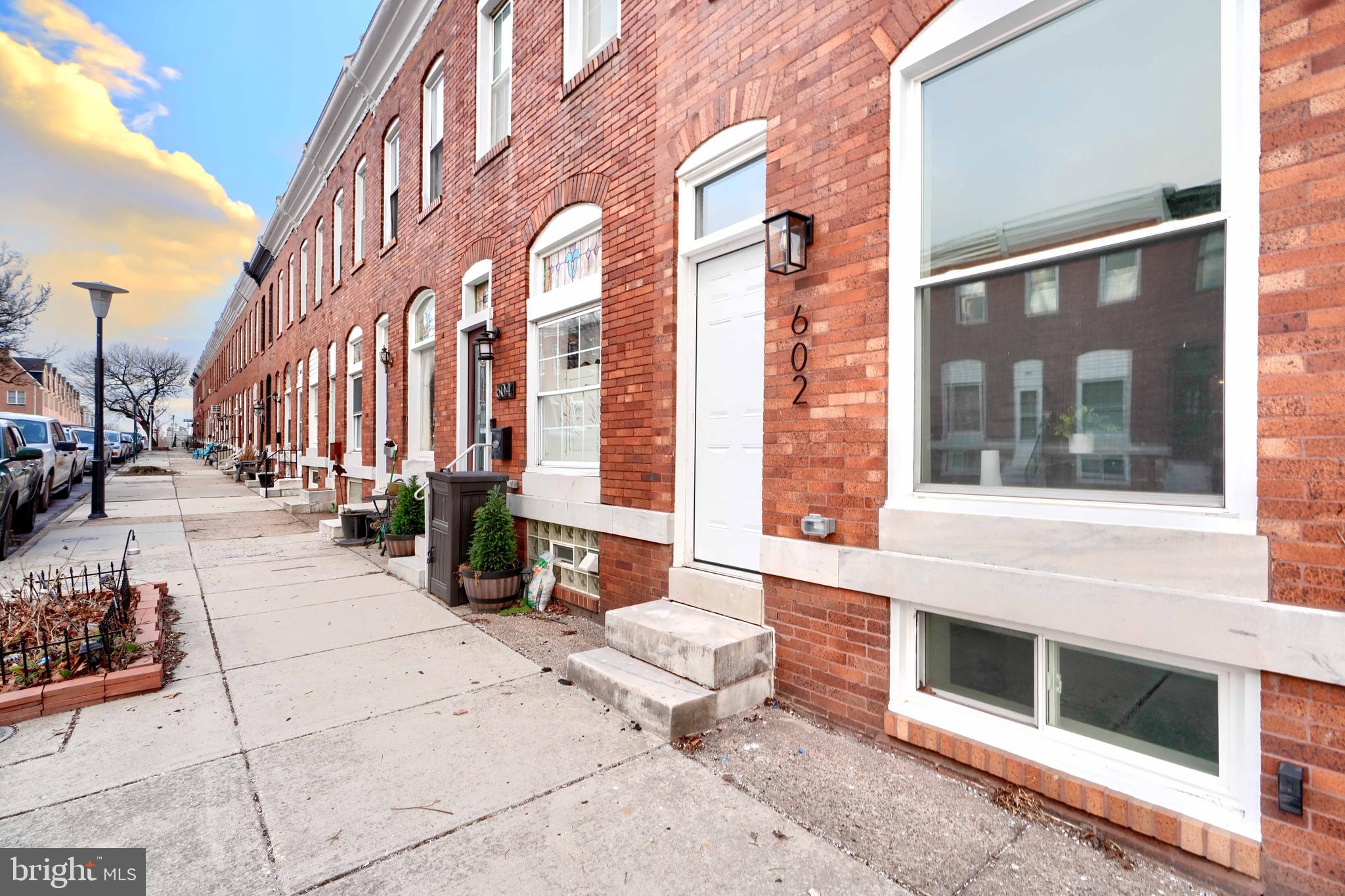 Welcome to 602 S Streeper St, a stunningly renovated gem in the heart of Baltimore's sought-after Patterson Park neighborhood. This home offers the perfect blend of modern luxury and prime location, making it a must-see for anyone seeking urban convenience and contemporary comfort. Situated just steps away from Patterson Park, one of Baltimore’s premier green spaces, this home is in a vibrant community filled with local cafes, restaurants, and boutique shops - as well as a top school district. You’ll enjoy the convenience of easy access to the Inner Harbor, Johns Hopkins, and major highways, ensuring your commute and lifestyle needs are seamlessly met. This beautifully updated home features four spacious bedrooms and three full bathrooms, including a primary suite. Hardwood floors flow throughout the main and upper levels, adding warmth and sophistication, while the fully finished basement offers a cozy retreat with plush carpeting—perfect for a media room, home office, or guest quarters. The home’s outdoor spaces are equally impressive, with a double-level deck that includes a rooftop deck boasting city views. These outdoor areas are ideal for entertaining or unwinding after a long day. Inside, the kitchen is a chef’s dream, complete with brand-new stainless steel appliances, a stylish quartz countertop, and a spacious island that’s perfect for meal prep or casual dining. This home is a rare find, offering unparalleled value in a thriving location. Whether you're looking to enjoy vibrant city life or relax in your beautiful new
space, 602 S Streeper St has it all.