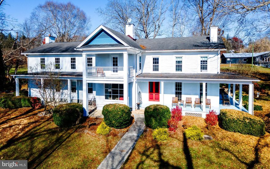 This a a rare opportunity to own a historical estate in the serene setting of Greenbrier County, WV.  Beautifully positioned on a hillside, with panoramic views of the town of Alderson and the not-so-distant mountains, "The Cedars" holds all of the character and charm of the late 1800's-early 1900's, but with all of the amenities for current needs.  Beautifully updated and curated, "The Cedars" welcomes you to relax and enjoy.  Come home and unwind on one of the many porches that this home has to offer.  Host exquisite events in the stunning Ballroom.  Work remotely from the private study. Or, create a gorgeous venue, a remarkable retreat, or a self-sufficient homestead. The estate is currently being utilized as a second residence and also for short term rentals through AirBnb. The opportunities are endless! 

The manor home boasts in excess of 6500 sq ft and features five bedrooms, four full baths. The main level presents an impeccably appointed kitchen with island seating, an informal gathering area, an expansive hallway and marvelous staircase, formal dining and living room space, a private main level wing (which includes the study, bedroom and full bath), a mudroom, and an attached garage. The upper level incorporates the ballroom, two private bedroom/bathroom suites, two additional bedrooms, and one additional bathroom,  Multiple porches, patios and balconies flank the home with advantageous views and  options for outdoor "living spaces".  The charming one bedroom/one bath log Cabin offers an additional 512 sq. ft. of very private and cozy accommodations for your guests. This historical homesite also includes three additional buildings; the two level, 20 stall horse barn, a smaller poultry or livestock barn, and a barn that has been converted to a maintenance and storage building, with equipment storage below. All three ancillary buildings do have electrical service.

*Total square footage reflected in this listing is 7088 sf and is inclusive of 512 sf 1 BR/1BA cabin. The manor home includes 5639 sf of finished living space and 937 sf of unfinished space (consisting of the mudroom and garage), and has 5 BR/4BA, with  1BR/1BA on the main level.

**Historical Information:
“The Cedars" was built in 1881 by Alexander McVeigh Miller on about 10 acres of land which was a gift from his father, William G. Miller. 
The house which is now called "The Cedars" was originally the home of Mittie Clark Miller who is credited with the authorship of eighty novels. Most of these were written in this house between 1881 and 1930 and earned her great wealth under the name of Mrs. Alex McVeigh Miller.
In 1939 it became the home of Mrs. Ruth Bryan Owen Rhode, the daughter of William Jennings Bryan. This talented woman was widely known and greatly respected as a writer, lecturer, university teacher, Congresswoman and diplomat. 
Mrs. Andrew McThenia, whose home this was for about thirty years beginning in 1945, gave time and energy to a well planned landscaping project, which involved the growing and use
of hundreds of English boxwoods throughout the almost 16 acres. 
"The Cedars" had its beginning in 1881 when Alexander McVeigh Miller brought his wife, Mittie Point Miller, to his home in Alderson. His father, V.G. Miller, gave him ten acres of his holdings on the edge of North Alderson in Greenbrier County. 
The Cedars was listed on the National Register of Historic Places in 1978."  (Mr. Roy E. Buckland)