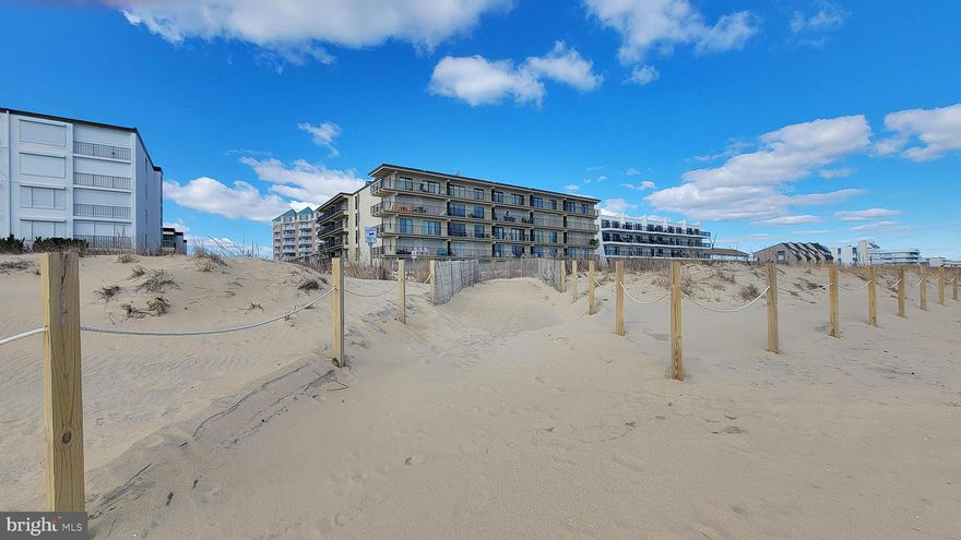 Welcome to Sandy Square #305, an incredible 3-bedroom, 2-bathroom direct oceanfront end-unit condo. The open kitchen, complete with a breakfast bar and dining area, offers ample seating for guests and seamlessly connects to the spacious living room. From here, step out onto the large balcony and be captivated by breathtaking ocean views - the perfect spot to savor your morning cup of coffee while enjoying the famous Ocean City, Maryland sunrise. One of the best features of this property is the expansive wraparound balcony, providing both oceanfront views and a unique perspective towards the bay. The primary suite, featuring balcony access, ocean views, and an ensuite bathroom. Two additional spacious bedrooms are complemented by a conveniently located full hall bathroom. Sandy Square's prime location in North Ocean City ensures easy access to the beach, restaurants, shops, and other popular attractions. Embrace the coastal lifestyle and indulge in the ultimate oceanfront experience!