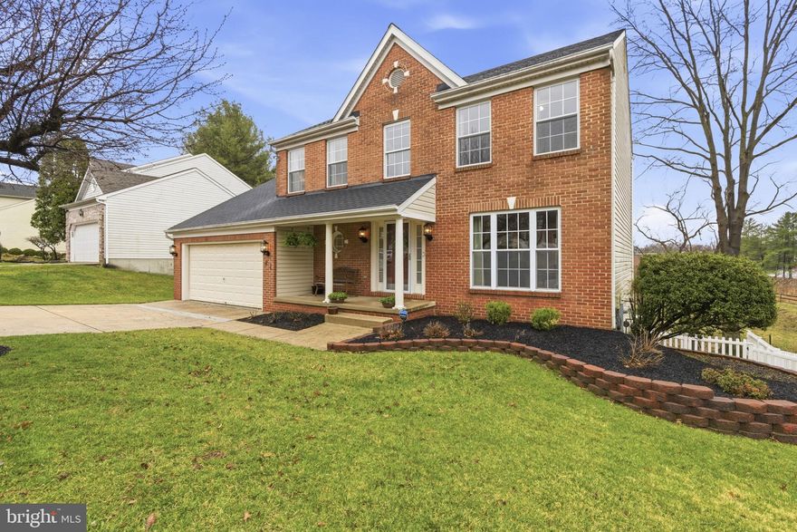 Welcome to this beautifully updated 4-bedroom Colonial with a 2-car garage, ideally located in the sought-after Perry Hall Courts neighborhood of Parkville. Thoughtfully designed and filled with natural light, this home offers a stylish yet comfortable layout perfect for everyday living and entertaining. Step inside to a welcoming foyer that opens to a bright living room featuring plush carpeting and elegant crown molding. The adjacent dining room is both refined and inviting, highlighted by a statement chandelier, decorative columns, chair rail, and crown molding—ideal for both casual dinners and formal gatherings. The heart of the home is the beautifully appointed kitchen, complete with granite countertops, stainless steel appliances, rich wood cabinetry, a spacious breakfast bar, and additional counter space perfect for a coffee station. Just off the kitchen, sliding glass doors lead to a large rear deck, creating a seamless indoor-outdoor flow. A sunken family room offers a cozy yet airy retreat, featuring a gas fireplace, vaulted ceilings, a ceiling fan, and soft carpeting—perfect for relaxing or hosting guests. A powder room and a convenient laundry area complete the main level. Upstairs, all bedrooms are comfortably carpeted, including the spacious primary suite with vaulted ceilings, creating a light and open feel. The upper level provides ample space for family, guests, or a home office setup. The finished lower level transforms into a true entertainment hub, featuring a bar area, stylish wood-paneled accent walls, a sauna, a dedicated gym space, and a half bath—offering endless possibilities for recreation and relaxation. This home combines style, space, and functionality in a prime location close to shopping, dining, commuter routes, and nearby parks.