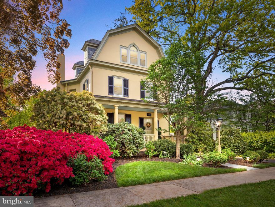 Elegant period details merge beautifully with today’s every convenience in this stunningly updated Dutch Colonial Revival sitting proudly on the most sought-after street in town. Lovingly cared for by the current owners for nearly 30 years, this beautiful 5 bedroom, 2.5 bath home offers four floors of living space. 

An expansive wraparound porch is an ideal setting for relaxing with your favorite beverage on a summer evening as neighbors stroll by. Step into the graceful entry foyer and admire the timeless beauty of the period millwork and architectural details, evoking an era renowned for its exquisite craftsmanship. A thoughtfully appointed living room features hand crafted period wallpaper, custom silk window treatments, a classic built-in cupboard, two cozy seating areas, and a traditional fireplace with convenient gas insert providing a warm ambiance on cool evenings. The design elements seamlessly extend into the sophisticated dining room, where loved ones come together to share meals and celebrate holidays. Additions, including the family room, kitchen, and sunroom, flow seamlessly from the original area of the home, each meticulously updated over the years by the current owners. Handcrafted cherry cabinets by a renowned local cabinetmaker, bespoke Mercer tile backsplash, artisan-crafted copper sink, and gleaming granite countertops are featured in the gracious kitchen. Adjacent, the stunning sunroom offers panoramic views of the verdant gardens, creating a tranquil retreat. As the sun begins to set relax and dine al fresco on the rear porch that was carefully designed with stately columns, period millwork, and a gambrel roof softly illuminated with cornice lighting, to blend harmoniously with this historic home. Retreat to the warm and inviting family room featuring a wood burning fireplace with brick surround and wood mantel inlayed with Mercer tile, flanked by custom built-ins with soft lighting to display your treasured books and cherished collections. 
A spacious second level features three bedrooms, one currently a light infused home office. Two neutral bathrooms, one boasting Carrara marble tile, radiant heat and oversized shower and the second appointed with white subway tile, marble flooring and classic tub and shower. The delightful third story boasts a large bedroom with numerous windows, one showcasing a custom commissioned stained-glass piece, plus a second bedroom offering a walk-in closet. The partially finished lower level includes a media/recreation area with extensive built-in cupboards for toys, games and sports gear, plus dedicated studio space for art or hobbies. An abundance of additional space is available for a workshop and storage. 

Stroll down the stone walkway through the enchanting gardens bursting with perennial blooms, to a private BBQ and covered outdoor dining area, perfect for dinner parties. The lush grounds, provide nearly a third of an acre for hosting larger gatherings. A full-size barn dating from 1906, includes a garage, workshop, substantial storage space, and an entire second level to create your own recreation room, studio, or home office. 
Whether entertaining or relaxing with family, this spectacular property will suit your every need. Enjoy the small-town lifestyle as you walk to the quaint boutiques and renowned restaurants of Historic Newtown Borough, attend the holiday parades, hometown festivals, and garden parties that are reminiscent of a bygone era.    Note: Owner is a PA licensed realtor.