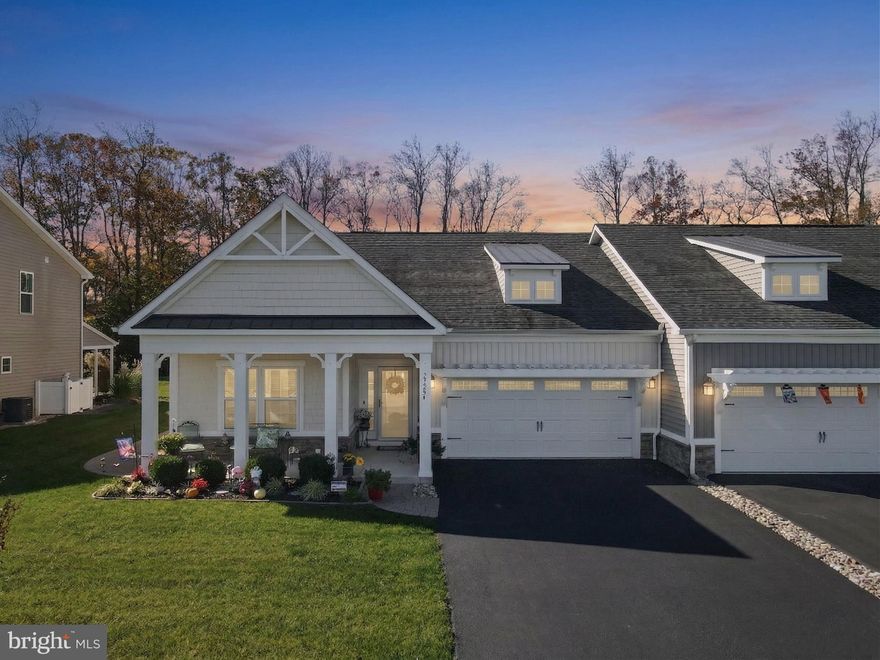 Welcome to low-maintenance, resort-style living at 27284 Shipwreck Dr in the coveted Lighthouse Lakes community of Selbyville, DE. This stunning single-level home is designed for modern living, featuring an open-concept living room with high ceilings that flows seamlessly into the gourmet kitchen, which boasts an inviting island, elegant granite counters, and upgraded stainless steel appliances. Relax and entertain year-round in the upgraded sunroom, which provides direct access to the private paver patio and a spacious backyard that backs up to tranquil trees. The luxurious primary suite is a true retreat, offering a large walk-in closet and a spa-like en-suite bathroom with a dual sink vanity and stall shower complete with dual shower heads. Two additional bedrooms and a hall bathroom ensure ample space for family or guests, while the charming exterior—featuring a covered front porch with columns, a paved driveway, and an attached front garage with an eyebrow pergola—offers excellent curb appeal. As a resident of Lighthouse Lakes, you'll enjoy a wealth of amenities, including an outdoor pool, splash pad, a clubhouse with a fitness center, putting green, tennis and pickleball courts, and a kayak launch via the community's dock. This prime coastal location puts you just a short 15-minute drive from the beaches of Fenwick Island and Ocean City, MD, with easy access to shopping, dining, and local attractions, making it the perfect blend of seaside escape and everyday convenience.