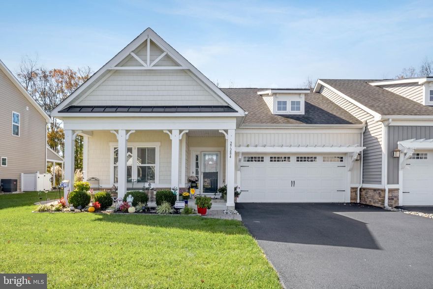 Welcome to low-maintenance, resort-style living at 27284 Shipwreck Dr in the coveted Lighthouse Lakes community of Selbyville, DE. This stunning single-level home is designed for modern living, featuring an open-concept living room with high ceilings that flows seamlessly into the gourmet kitchen, which boasts an inviting island, elegant granite counters, and upgraded stainless steel appliances. Relax and entertain year-round in the upgraded sunroom, which provides direct access to the private paver patio and a spacious backyard that backs up to tranquil trees. The luxurious primary suite is a true retreat, offering a large walk-in closet and a spa-like en-suite bathroom with a dual sink vanity and stall shower complete with dual shower heads. Two additional bedrooms and a hall bathroom ensure ample space for family or guests, while the charming exterior—featuring a covered front porch with columns, a paved driveway, and an attached front garage with an eyebrow pergola—offers excellent curb appeal. As a resident of Lighthouse Lakes, you'll enjoy a wealth of amenities, including an outdoor pool, splash pad, a clubhouse with a fitness center, putting green, tennis and pickleball courts, and a kayak launch via the community's dock. This prime coastal location puts you just a short 15-minute drive from the beaches of Fenwick Island and Ocean City, MD, with easy access to shopping, dining, and local attractions, making it the perfect blend of seaside escape and everyday convenience.