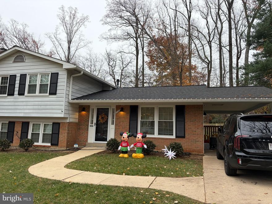 Fully renovated in 2021, hardwood floors throughout the top 2 levels, LVP in the basement. Flagstone patio, fully fenced yard, carport.