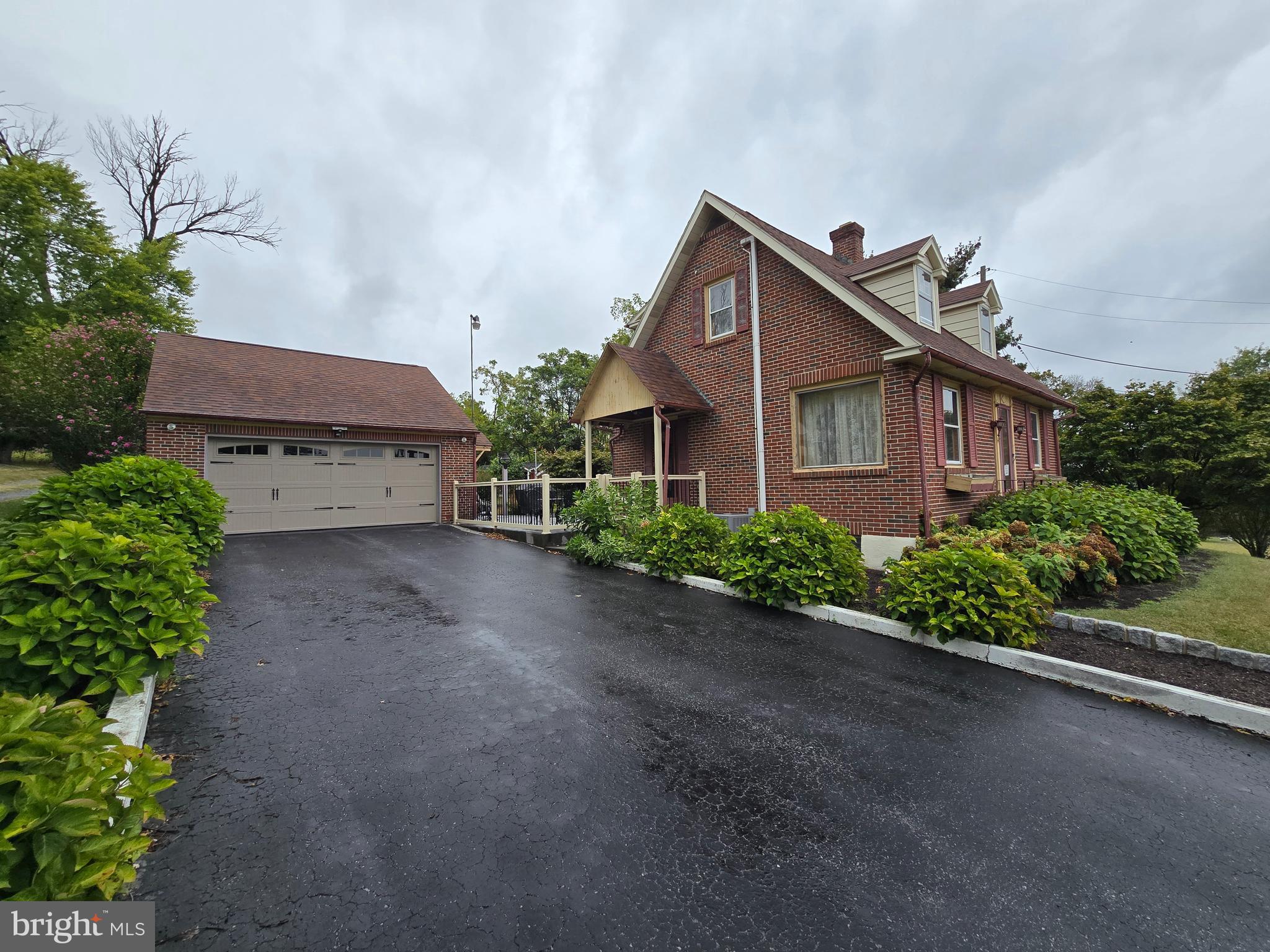 Looky Looky at this beauty! 231 Douglass Drive is a solid built house on a nice .53 acre lot, conveniently located close to route 422, 562, 662, and 100. Pull in the driveway up to the 2 car garage and come on inside. The main floor offers the kitchen with solid cherry wood cabinets and plenty of counter space. The dining room and half bathroom are off from the kitchen. The spacious living room provides access to the comfy side porch that you can enjoy with the lovely weather. The living room also has a beautiful wood burning fireplace to help you snuggle in during the chilly weather. Upstairs are two bedrooms and a full bathroom. The basement provides additional hangout space, laundry room, and utility storage area. Outside the patio space is divine! Gorgeous hard -scaped patio in a fenced area is perfect for entertaining and relaxing. Plenty of open yard space outside of the fenced area along with sheds for storage. I can't forget to mention the awesome 2 car garage that has loft space for storage. This Boyertown School District house won't last long, get your tour scheduled.