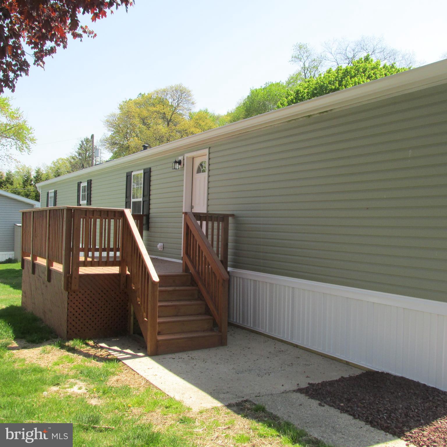 Completely remodeled single wide home in Taylors Mobile Home Park, a 55+ community of well kept homes with easy access to shopping and major routes. New roof, siding, windows, doors, interior walls, new kitchen cabinetry with granite counters and ceramic backsplash, new SS appliances, updated full bath with walk ceramic tiled shower, new half bath, new laminate and w/w carpet flooring throughout, 8'x12' front deck, new 8'x'8' storage shed. Ready to move in - Don't miss it!!